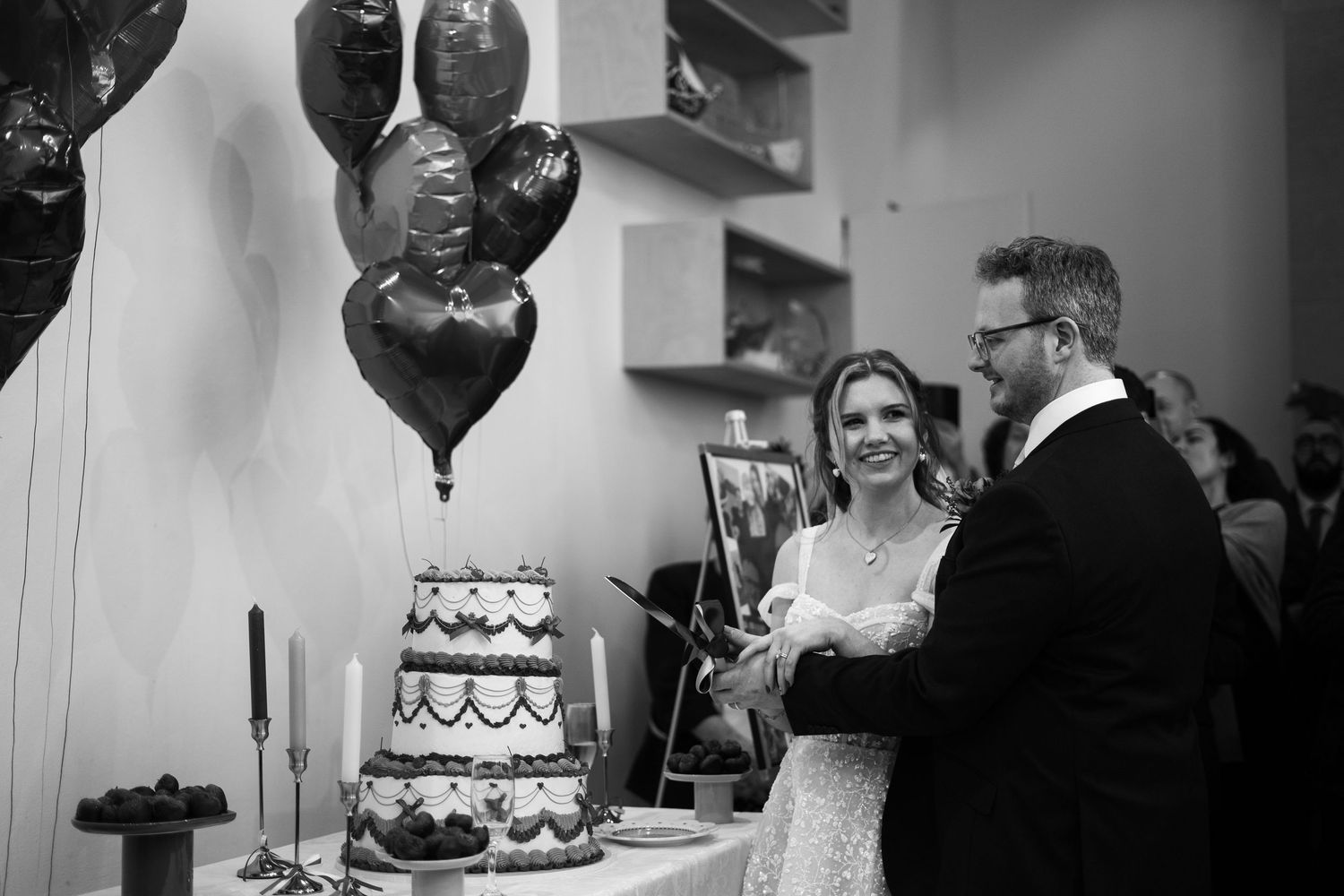 Bride and groom cutting the cake during a wedding in Cornwall