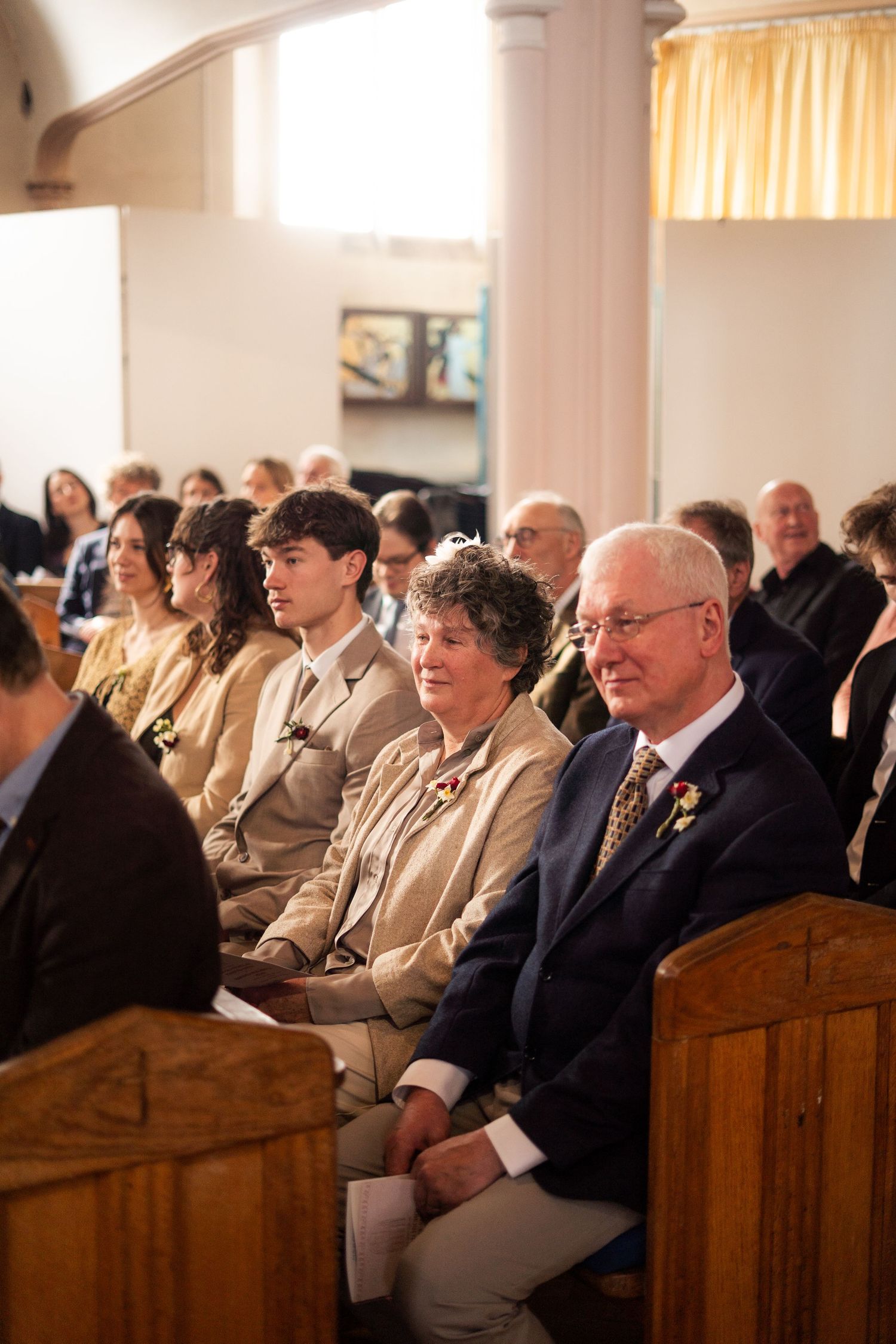 Wedding guests watching a ceremony in Penzance Church, Cornwall