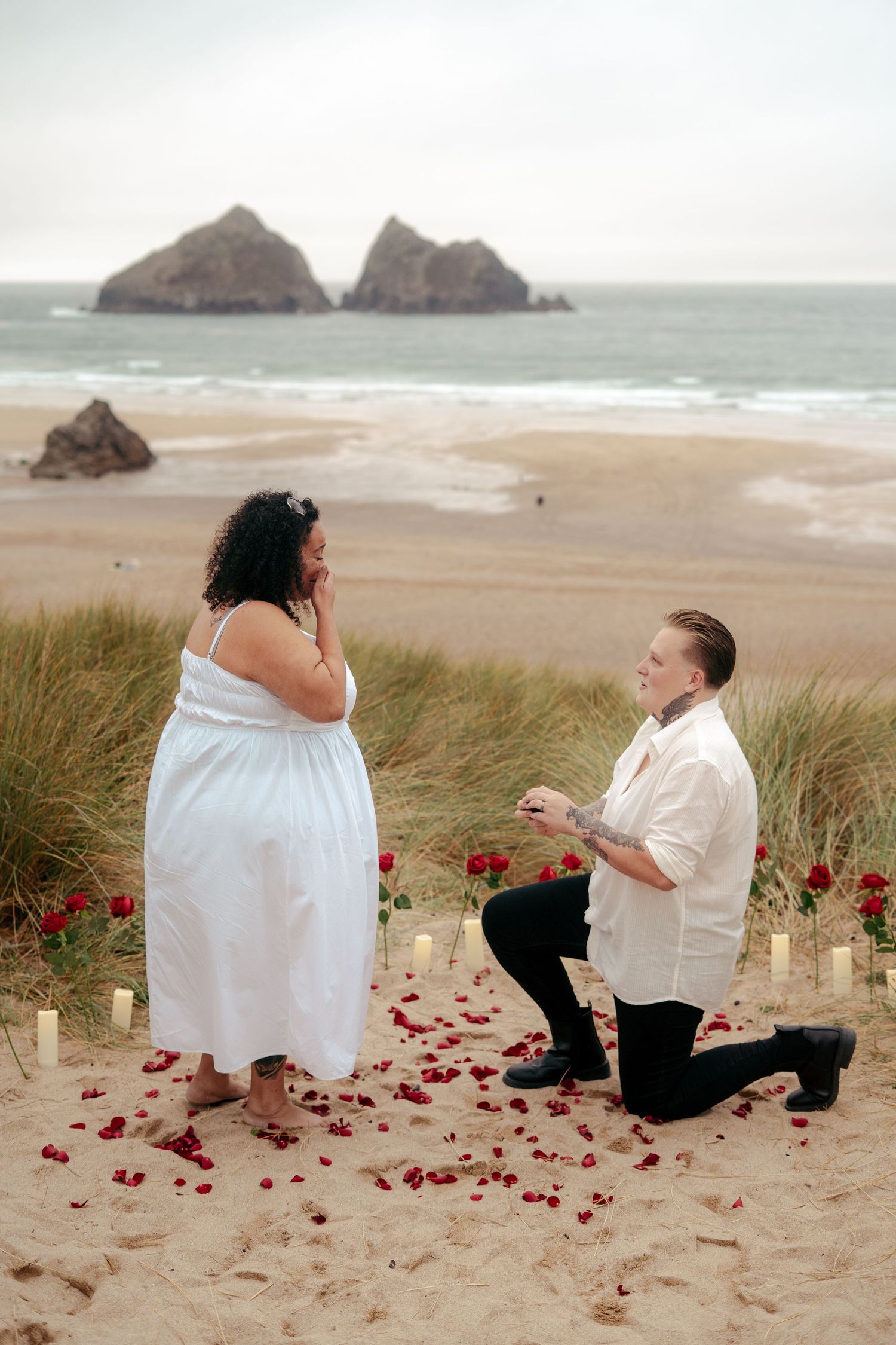 A woman proposing to her girlfriend on the beach in Cornwall. Tags: wlw, lesbian, LGBTQ+, queer photographer.
