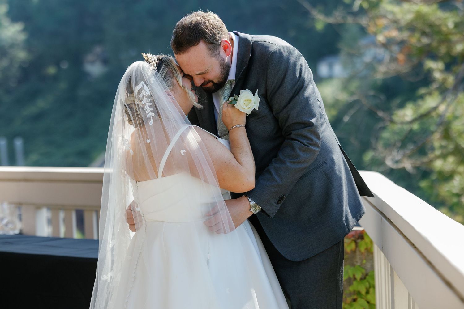 Elegant outdoor wedding photography session on a scenic balcony.