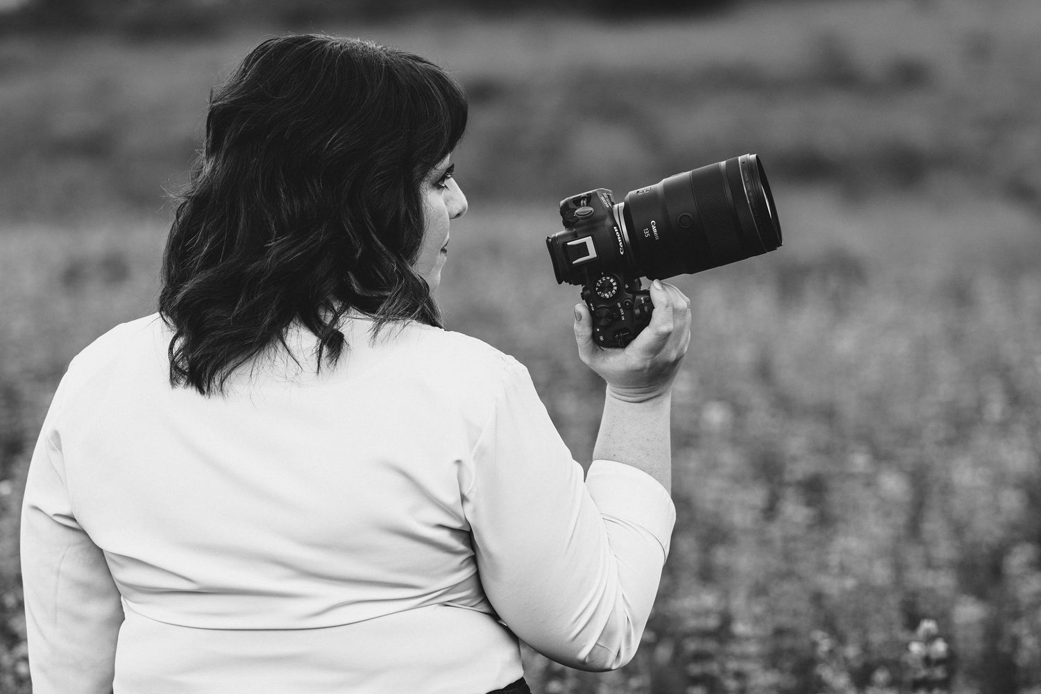 Monochrome sequence of a photographer with camera in natural lighting.