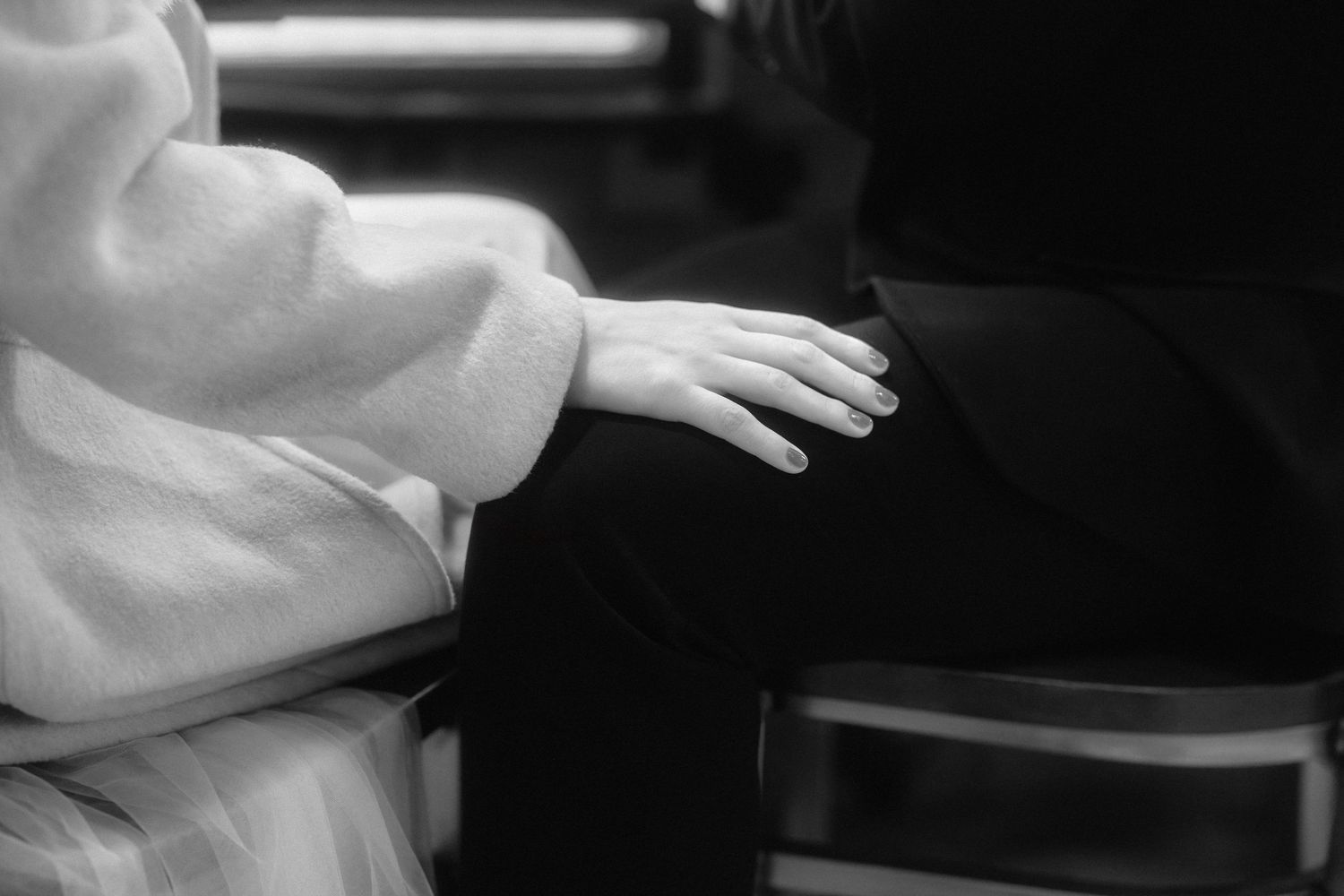A series of black and white photographs showing close-up details of a wedding dress and veil.