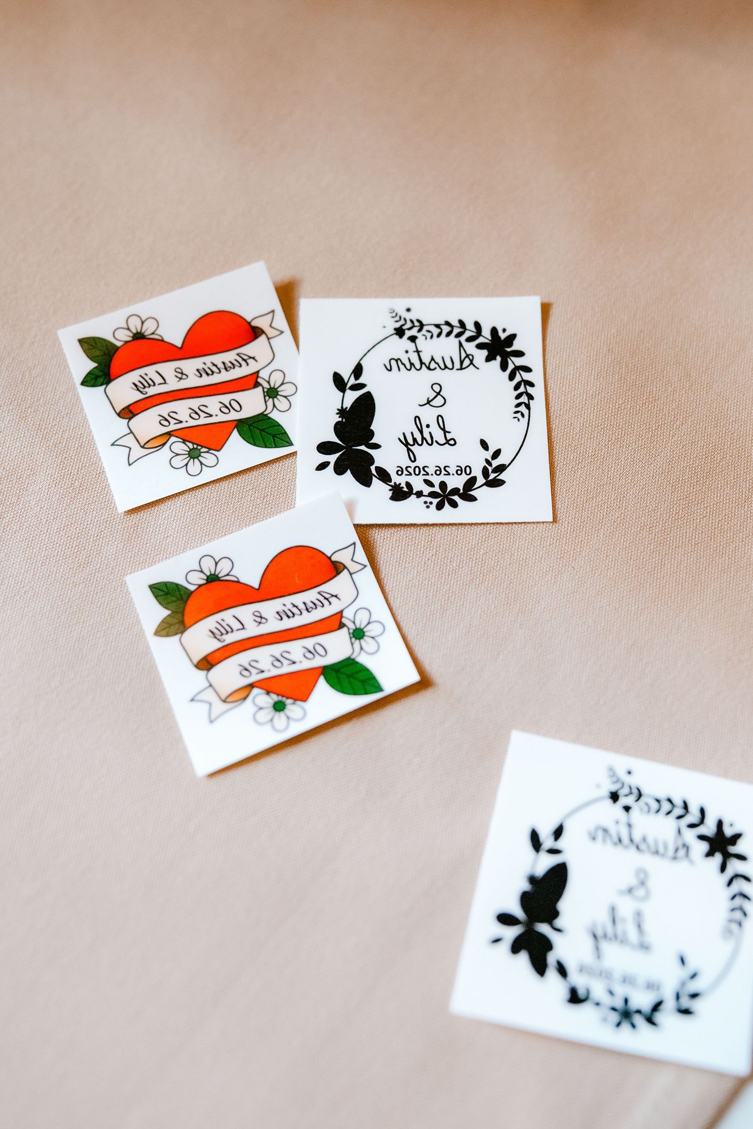 Custom wedding temporary tattoos with heart and floral wreath designs featuring couple names and date.