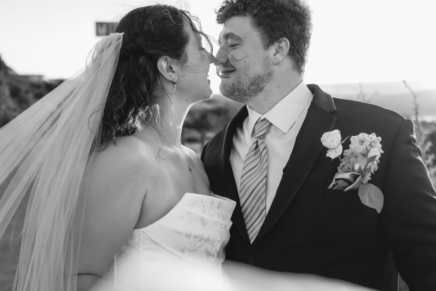 Black and white romantic wedding photography captures intimate couple moments.