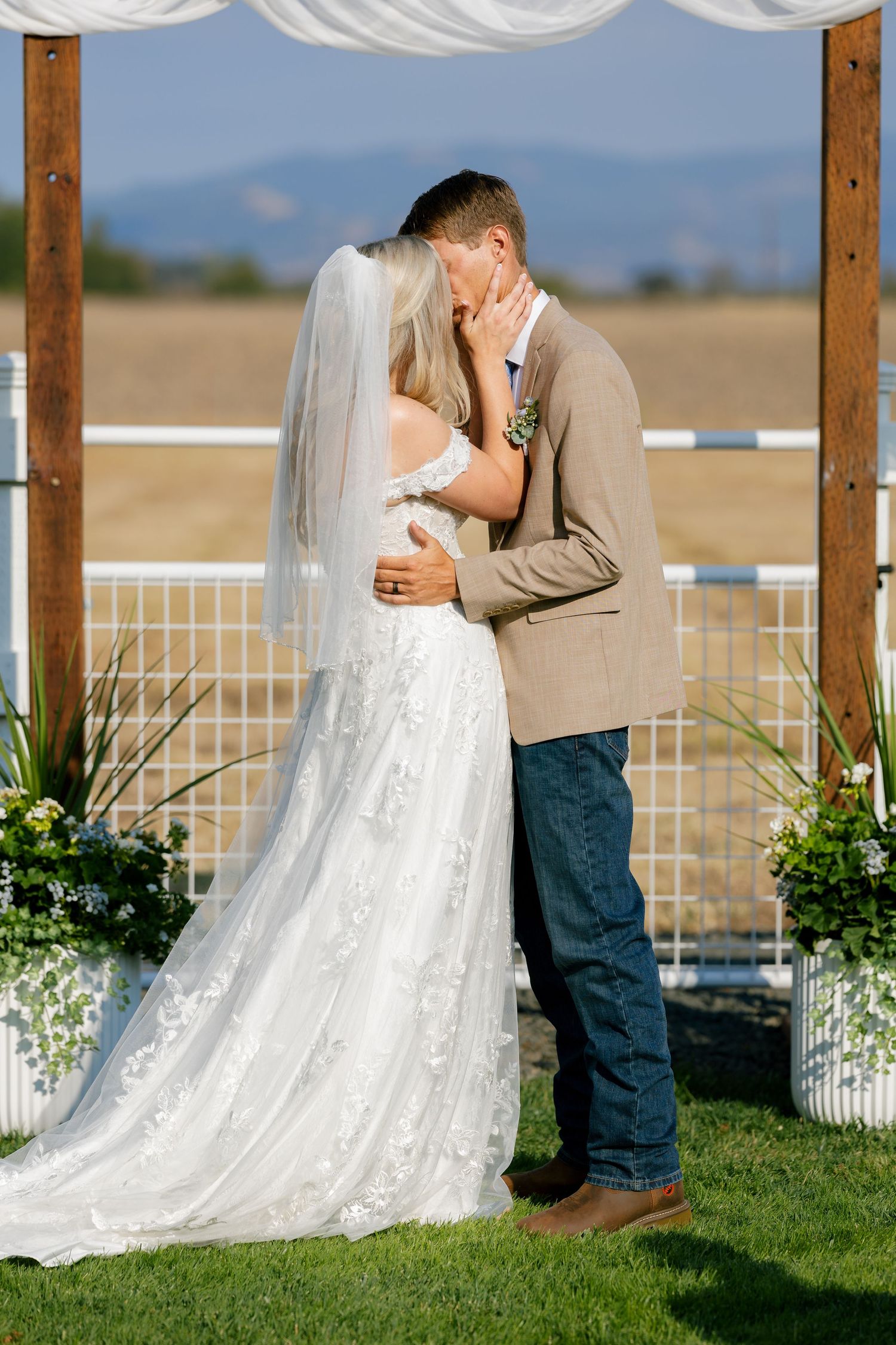 A romantic sequence of moments under a wooden pergola with white draping and mountain views.