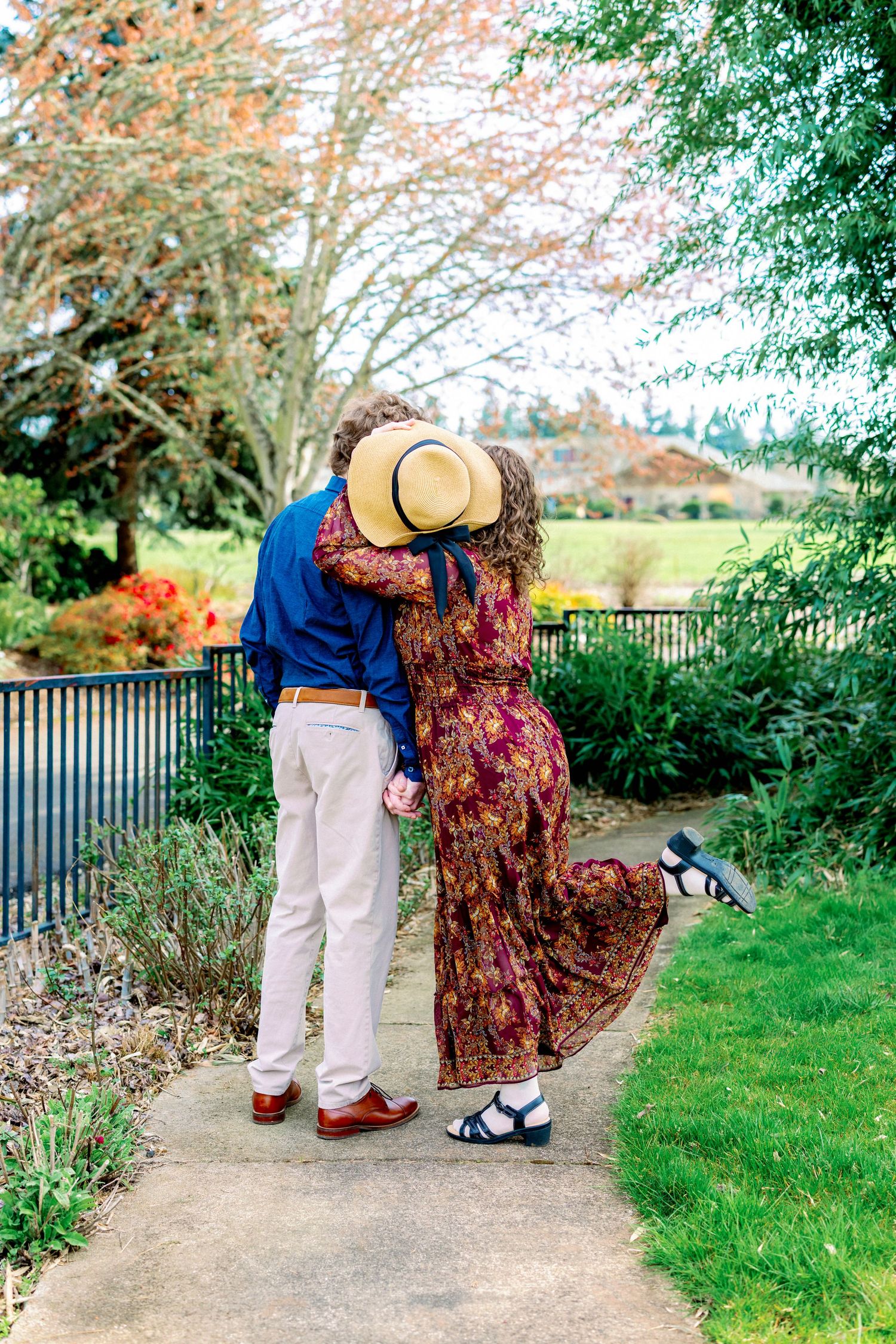A series of romantic moments captured on a garden path with greenery in the background.