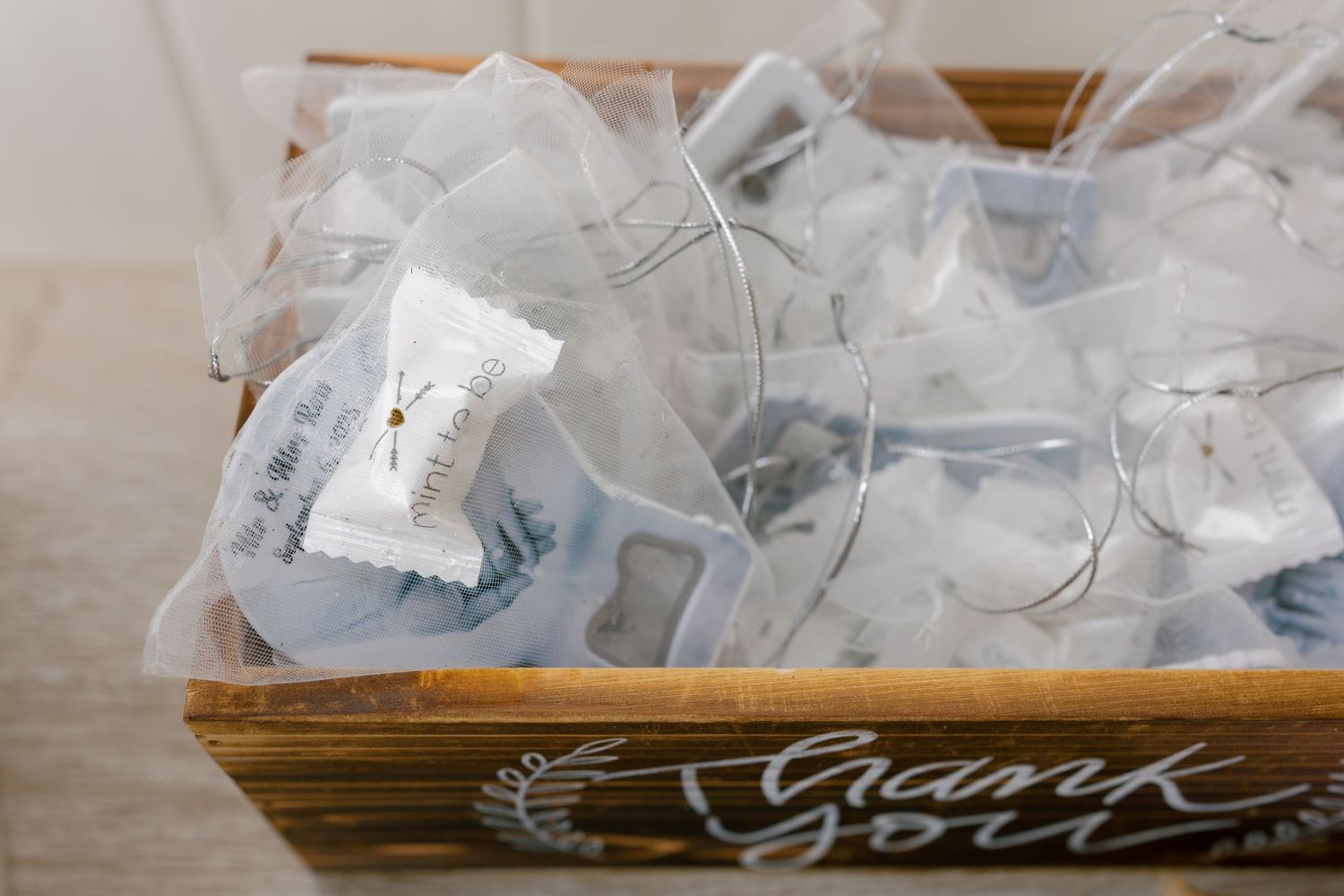 Wedding decorations and supplies arranged on a wooden surface.