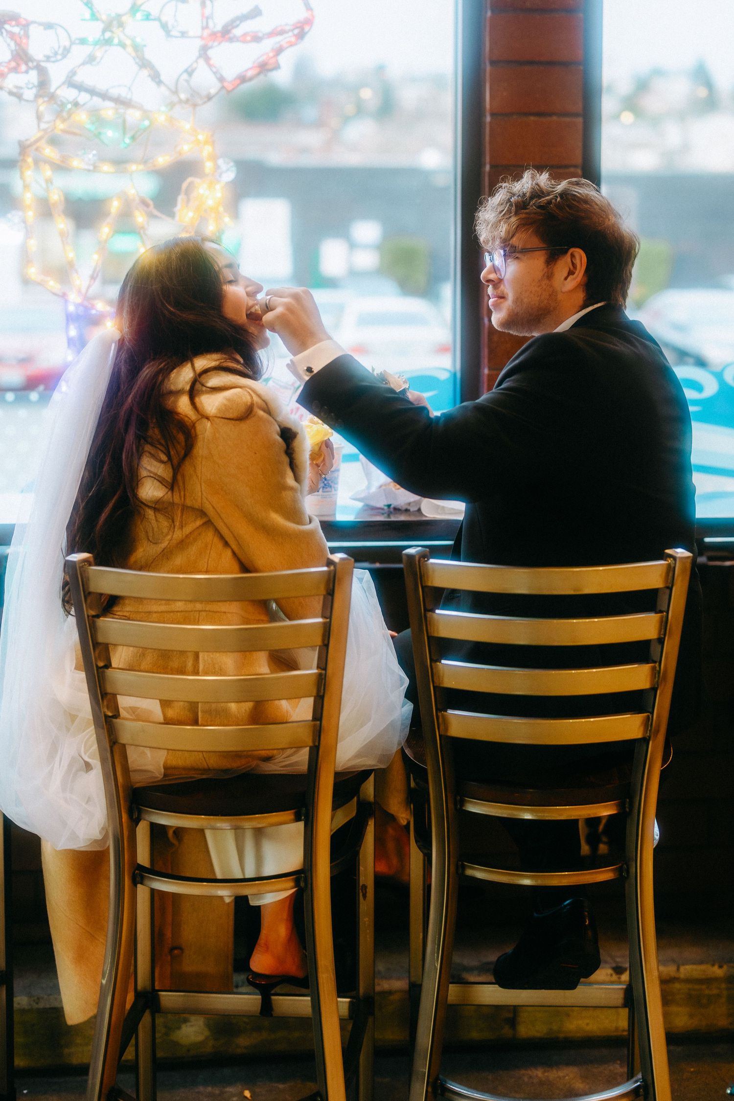 Couple sitting together at a cafe sharing intimate moments across multiple candid frames.