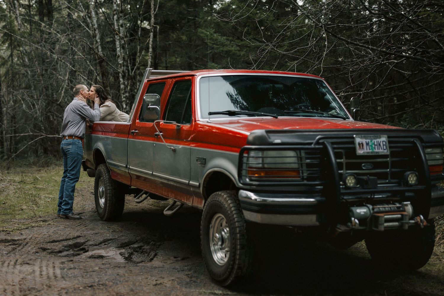 A series of vintage pickup trucks parked in a wooded area showing different angles of the vehicles.