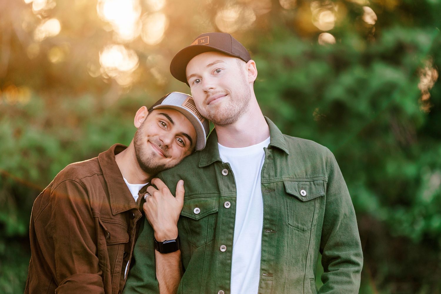 Romantic outdoor photoshoot with warm bokeh lighting effects in nature.