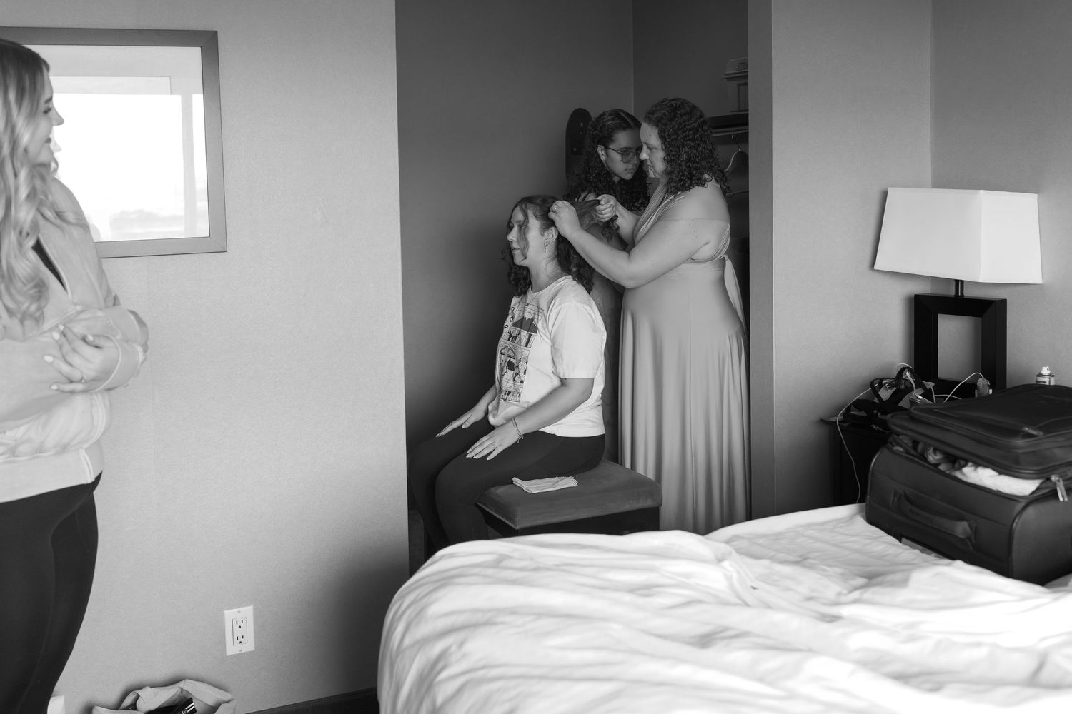 Black and white sequence of intimate moments in a bedroom setting.