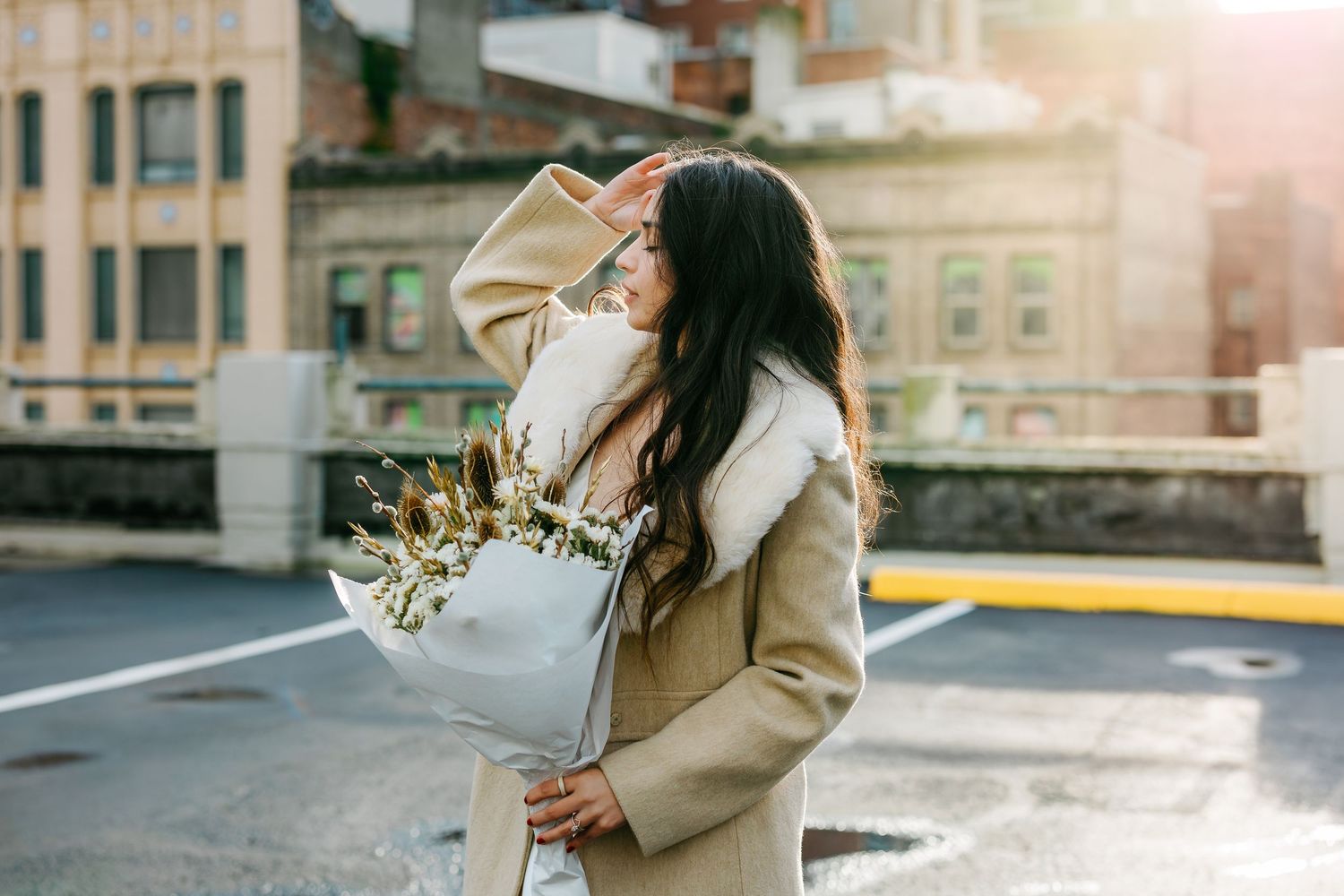 Romantic moment captured on city street during golden hour.