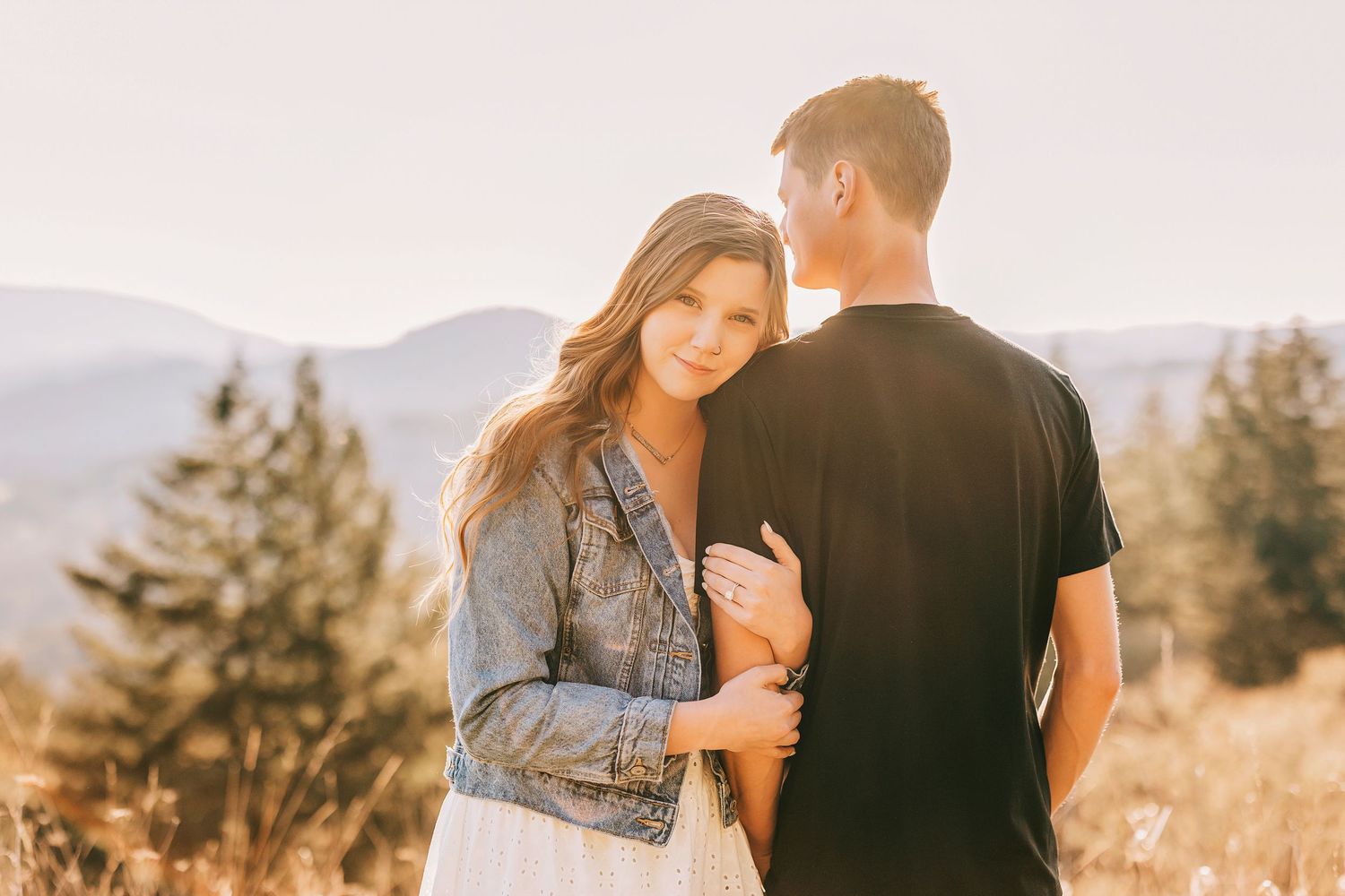 A romantic photoshoot sequence captured against a warm sunset backdrop.