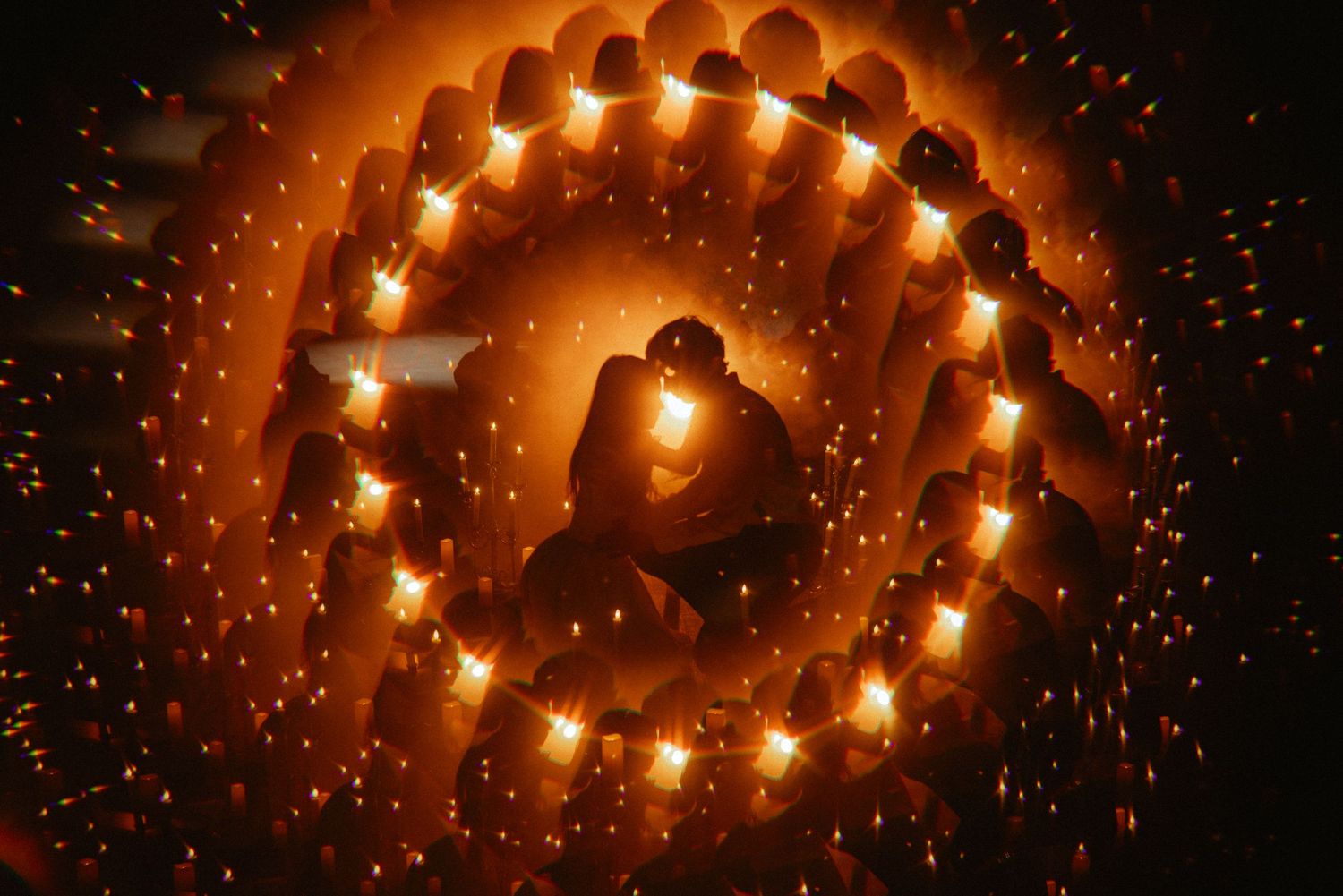 A sequence of spiral light fixtures arranged in a row showing different angles of illuminated circular chandeliers.