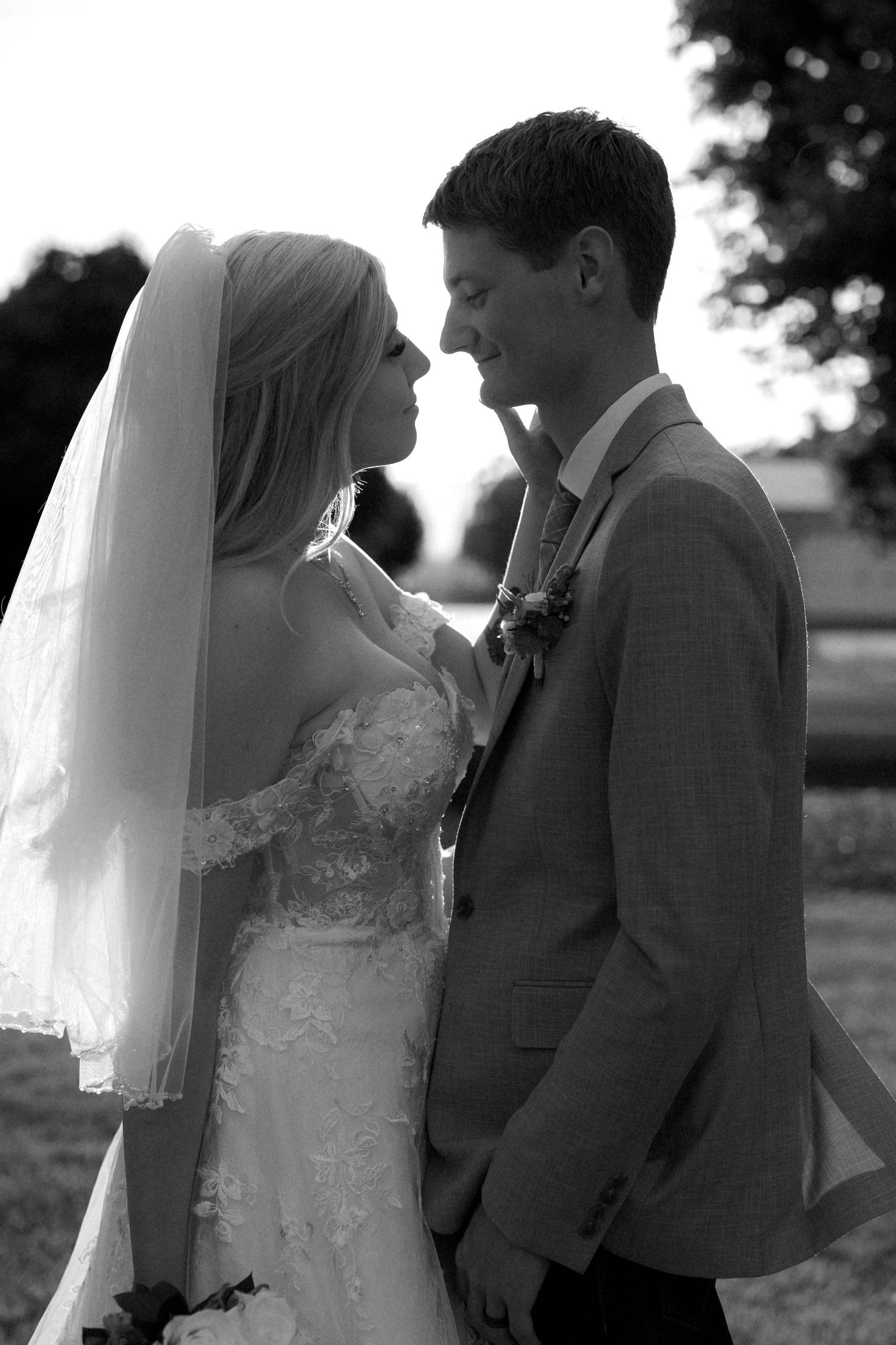 Black and white romantic wedding portraits showing tender moments between newlyweds.