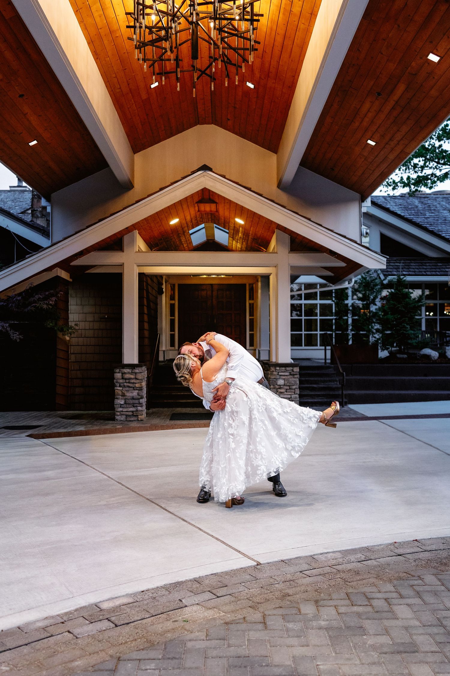 A creative sequence of wedding photos showing a couple dancing and dipping on an outdoor patio with wooden beams overhead.