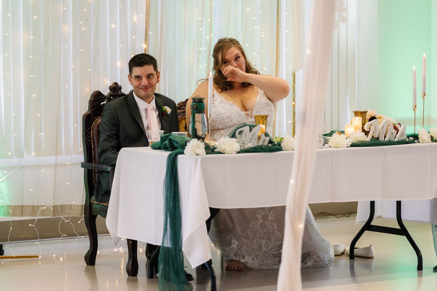 Wedding reception celebration with guests dancing and mingling in an elegantly decorated venue.