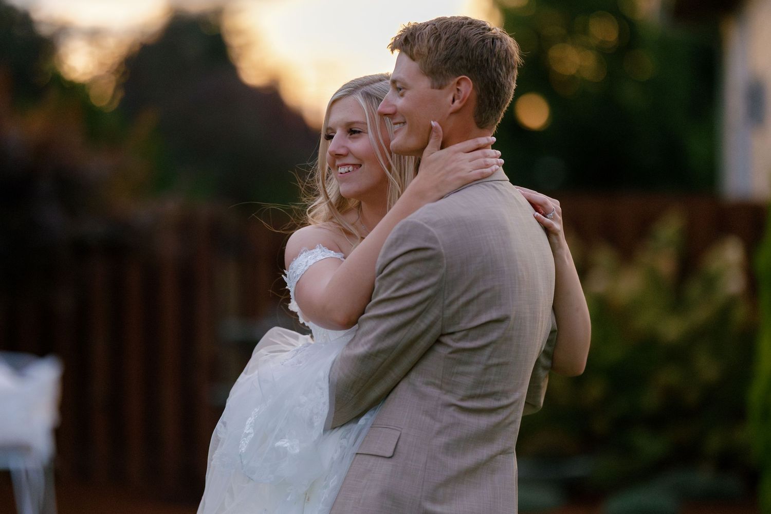 A tender sunset embrace captured in warm golden light.