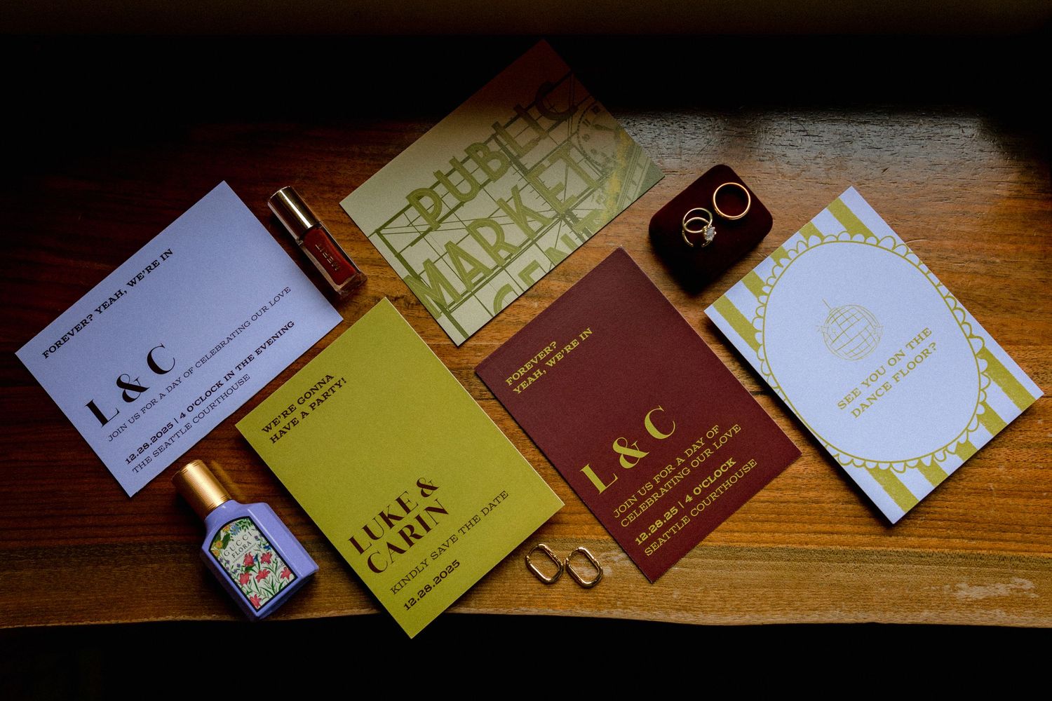 Elegant gold and brown business cards arranged in a scattered pattern on a wooden surface.