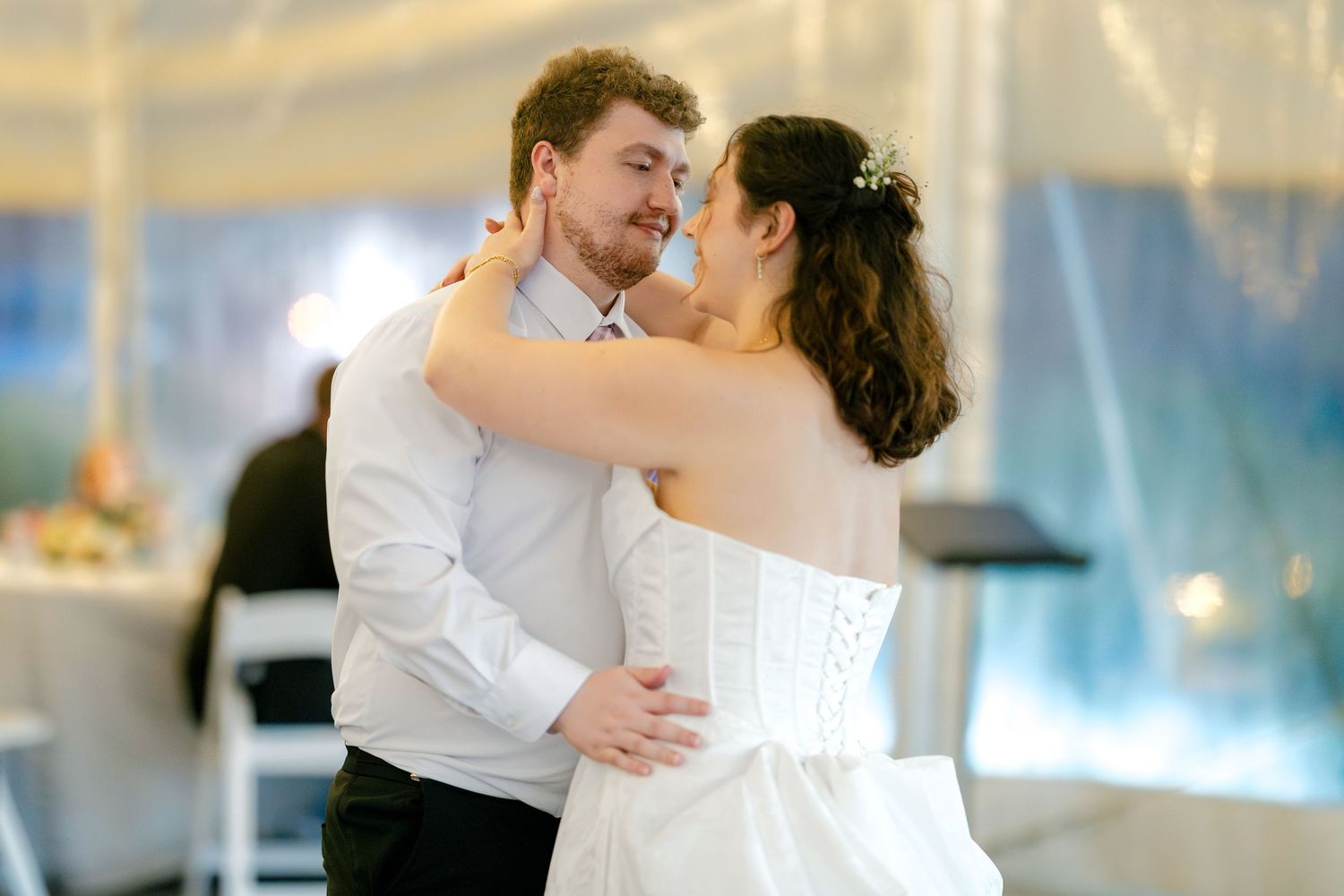 Couples dancing together during romantic moments at the wedding reception.