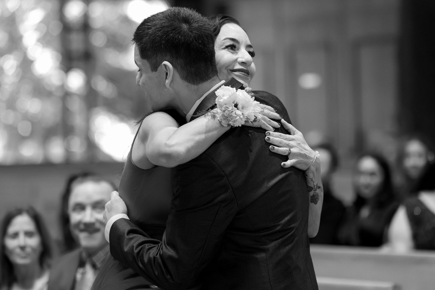 Black and white candid moments from a wedding reception dance.