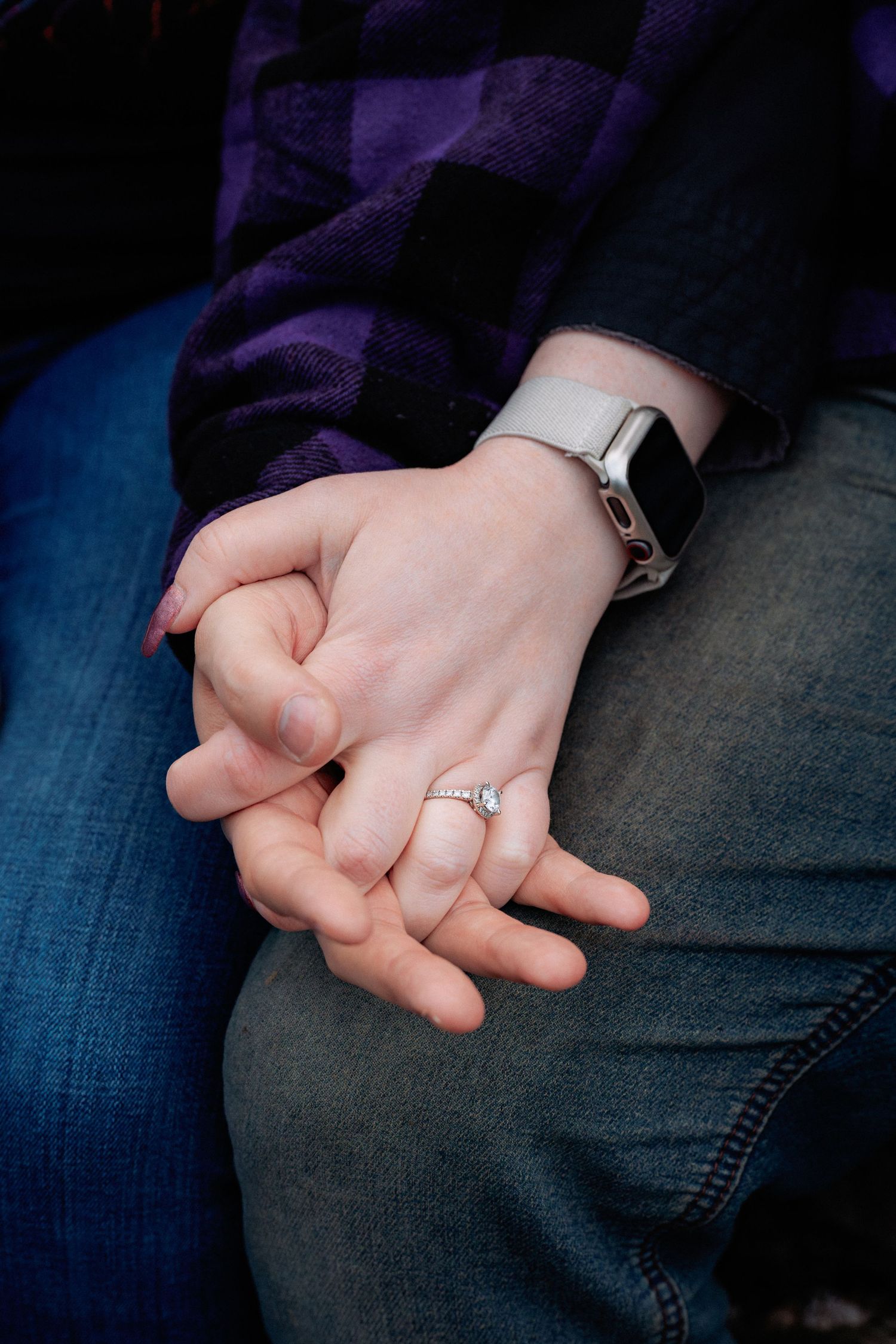 Close-up sequence of hands clasping together, with an engagement ring visible on one finger.