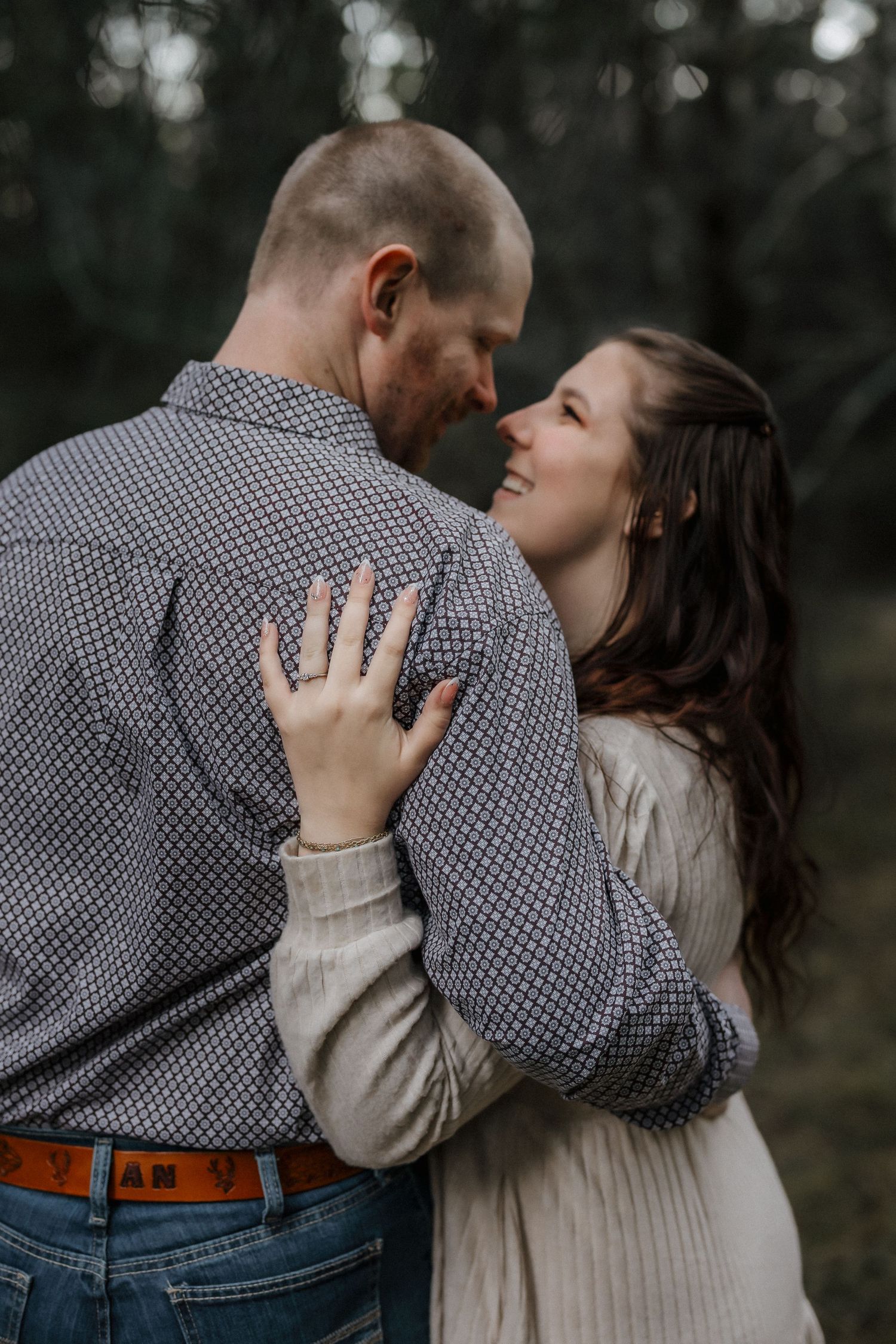 A tender embrace captured in a series of intimate moments between a couple wearing casual attire.