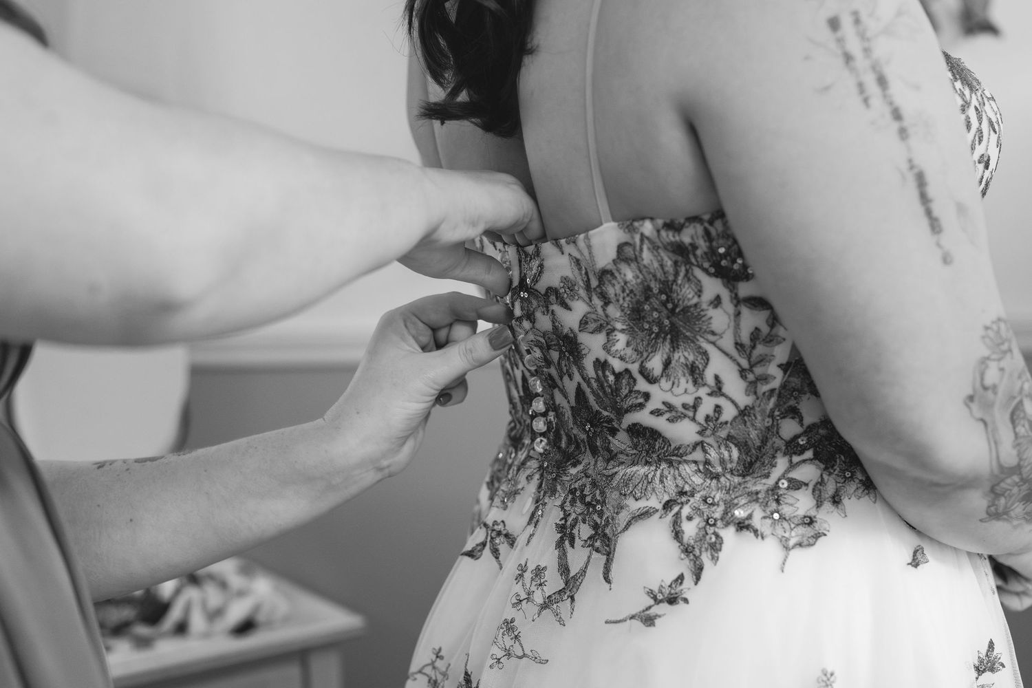 Close-up detail of a floral patterned dress fabric in black and white.