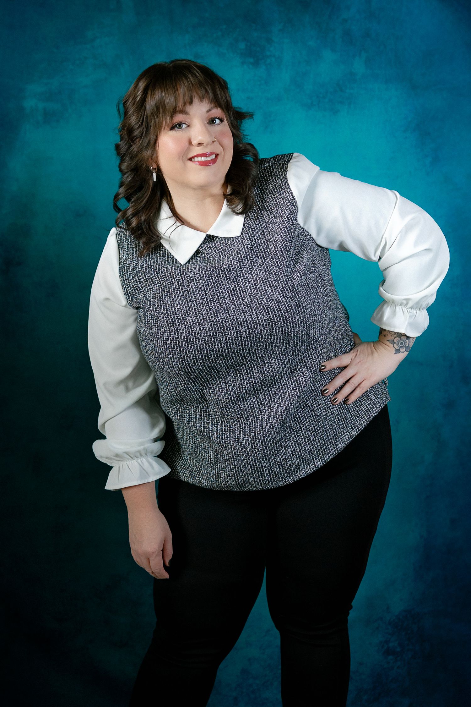 Studio portraits showing business casual attire against a deep teal background.