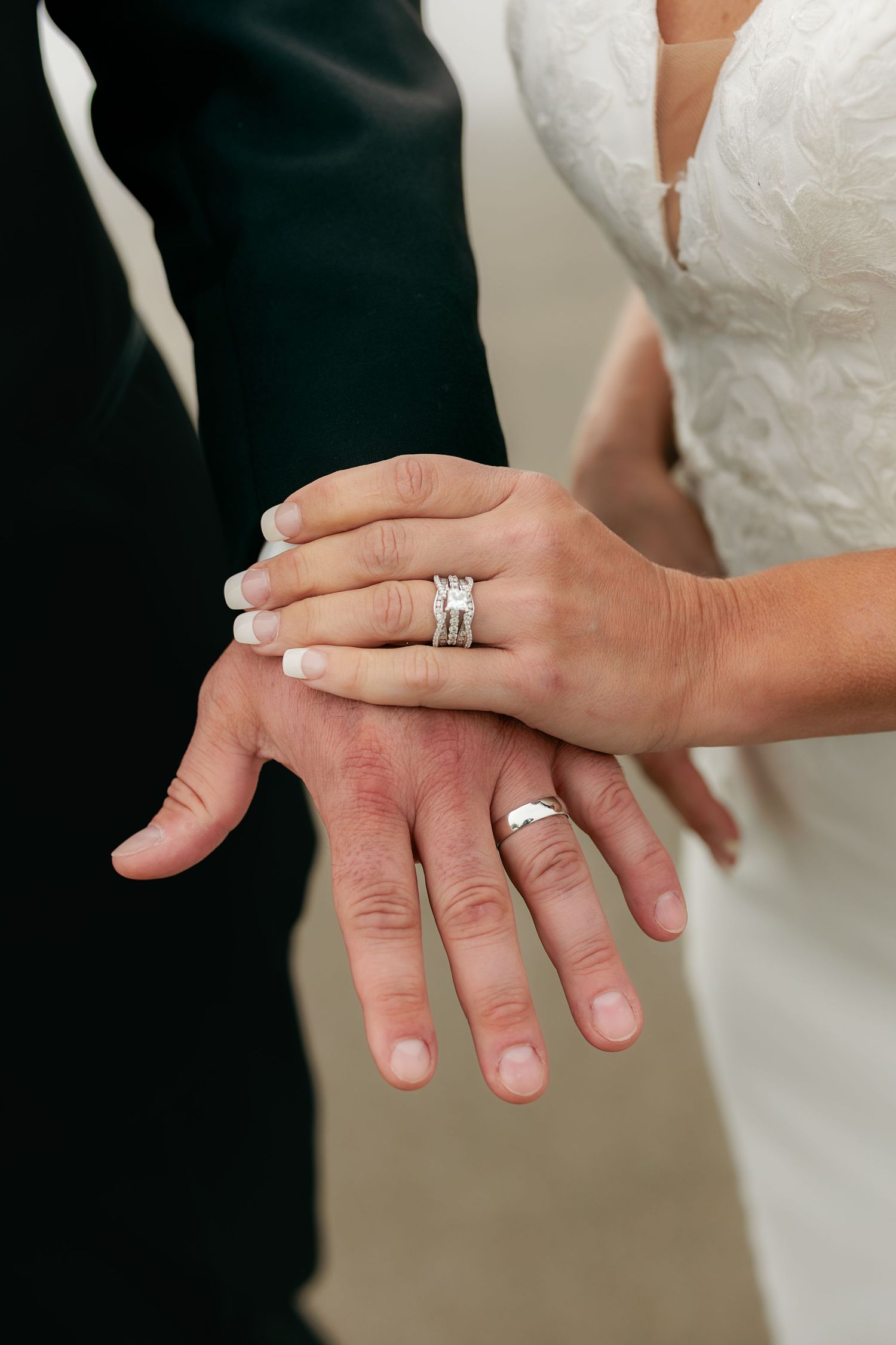 Close-up shots of hands and wedding rings during a ceremony.