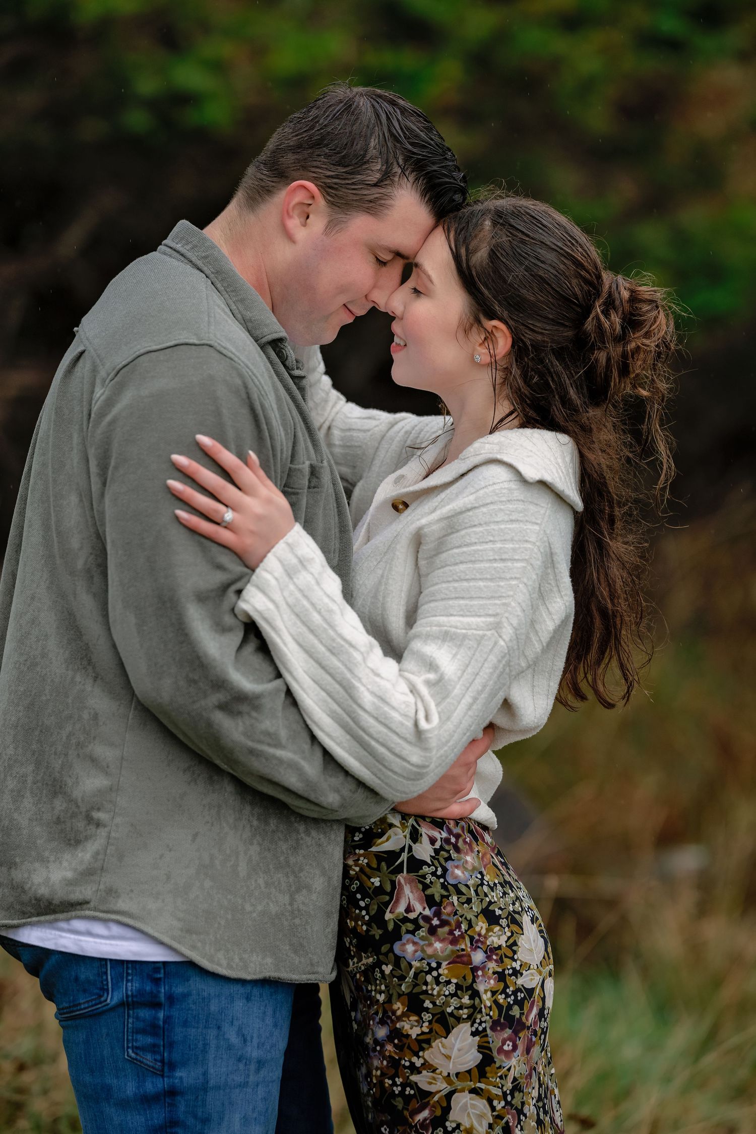Romantic couple embraces in a series of intimate outdoor photos wearing casual autumn clothing against natural backdrop.