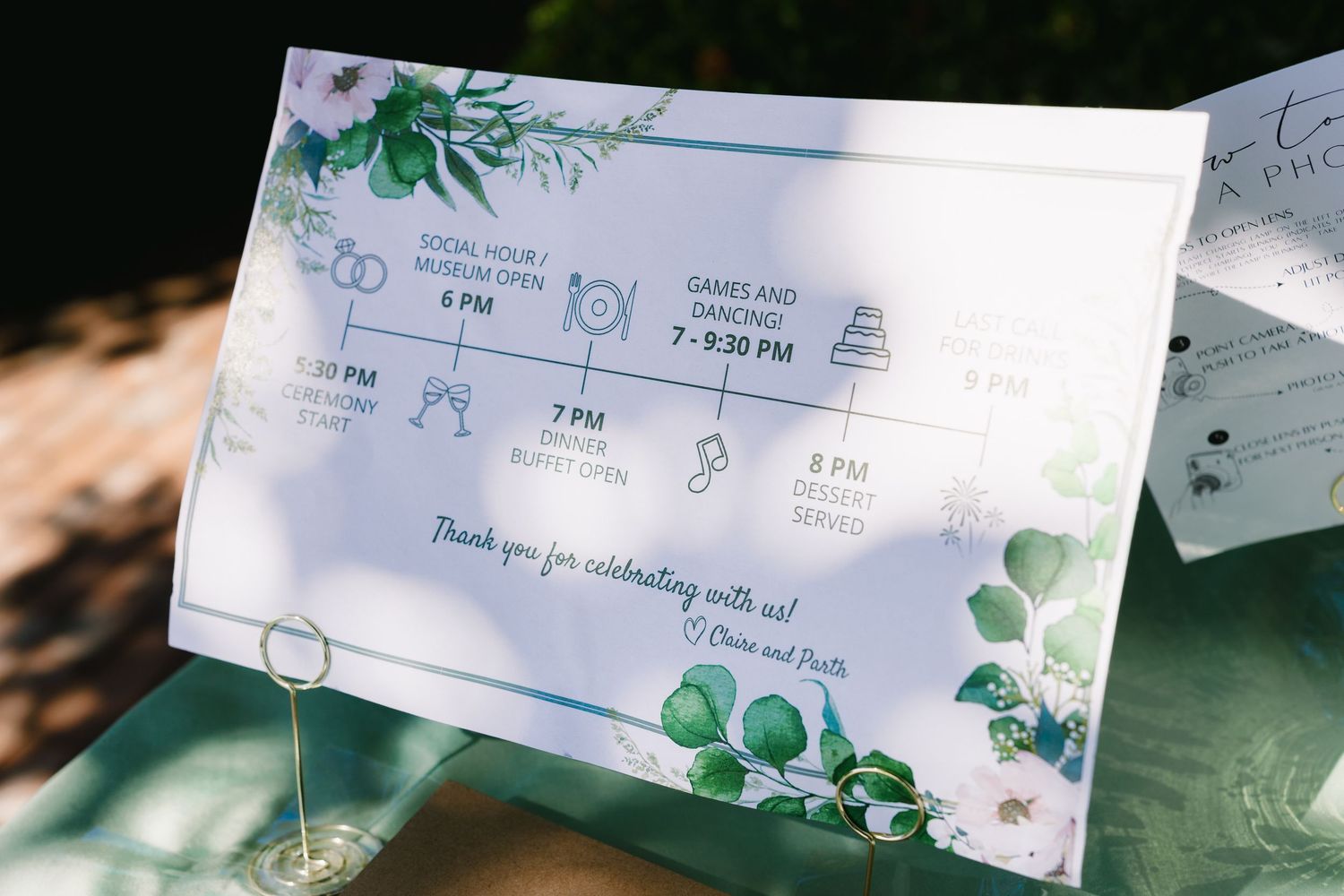 Wedding invitation details with green floral design and schedule cards.