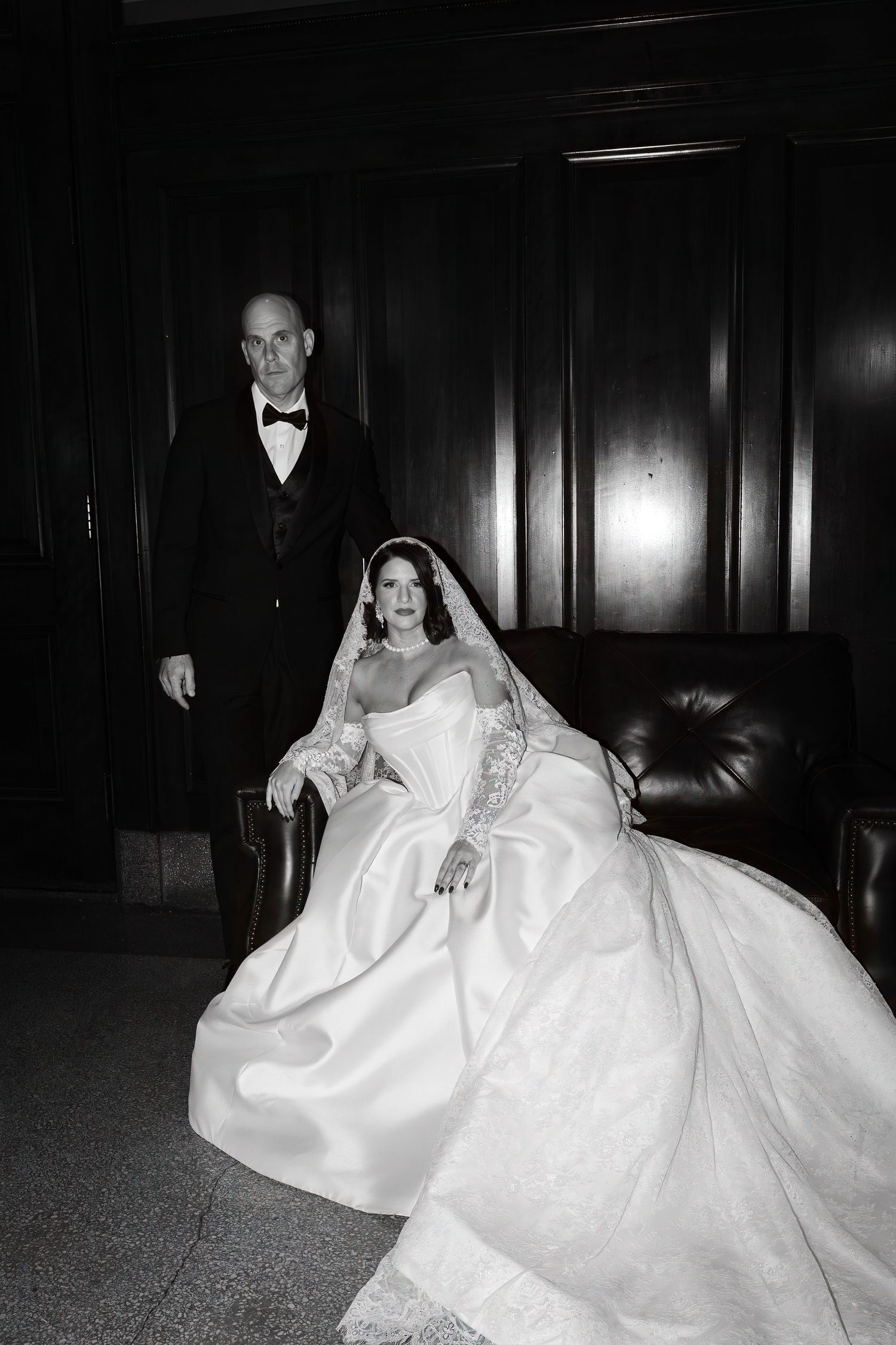 High fashion editorial style Bride and groom embracing during civil courthouse ceremony in Portland ME captured in documentary film style