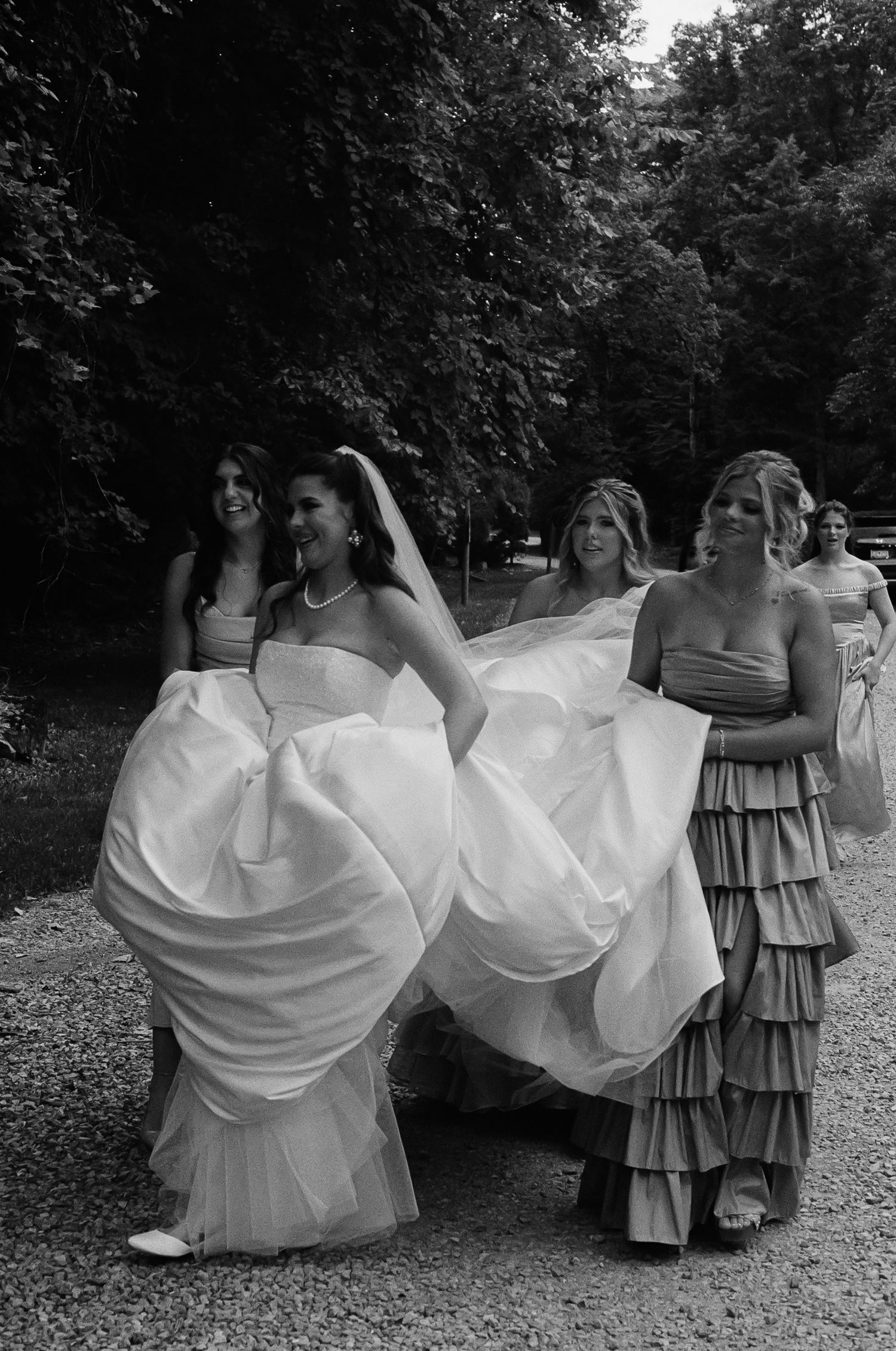 Bride with bridesmaids during outdoor wedding ceremony in Nashville TN captured in documentary film style
