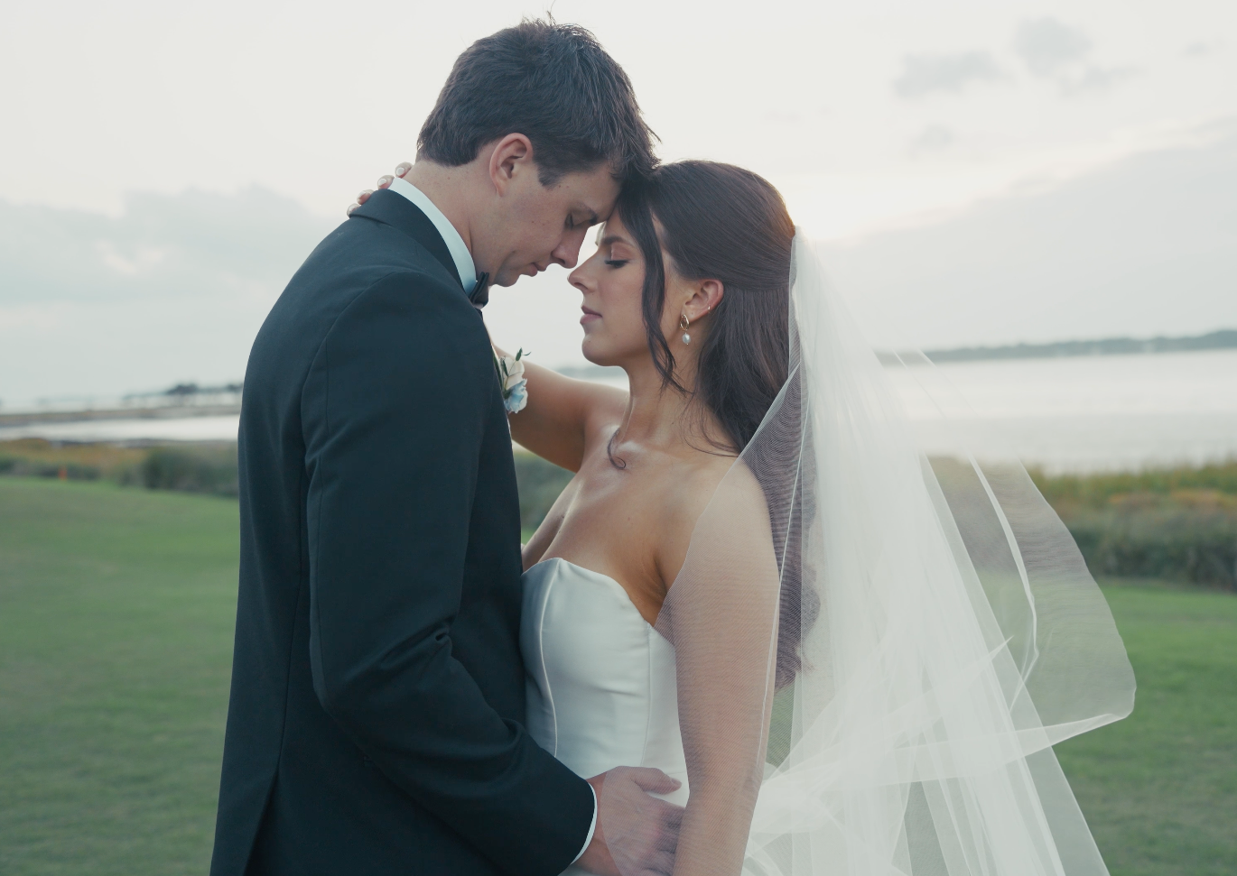 Bride and groom embracing during outside beach wedding ceremony in Hilton Head SC captured in documentary film style