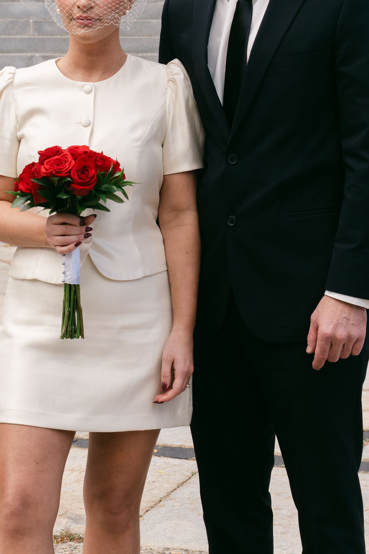 Bride and groom embracing during civil courthouse ceremony in Portland ME captured in documentary film style