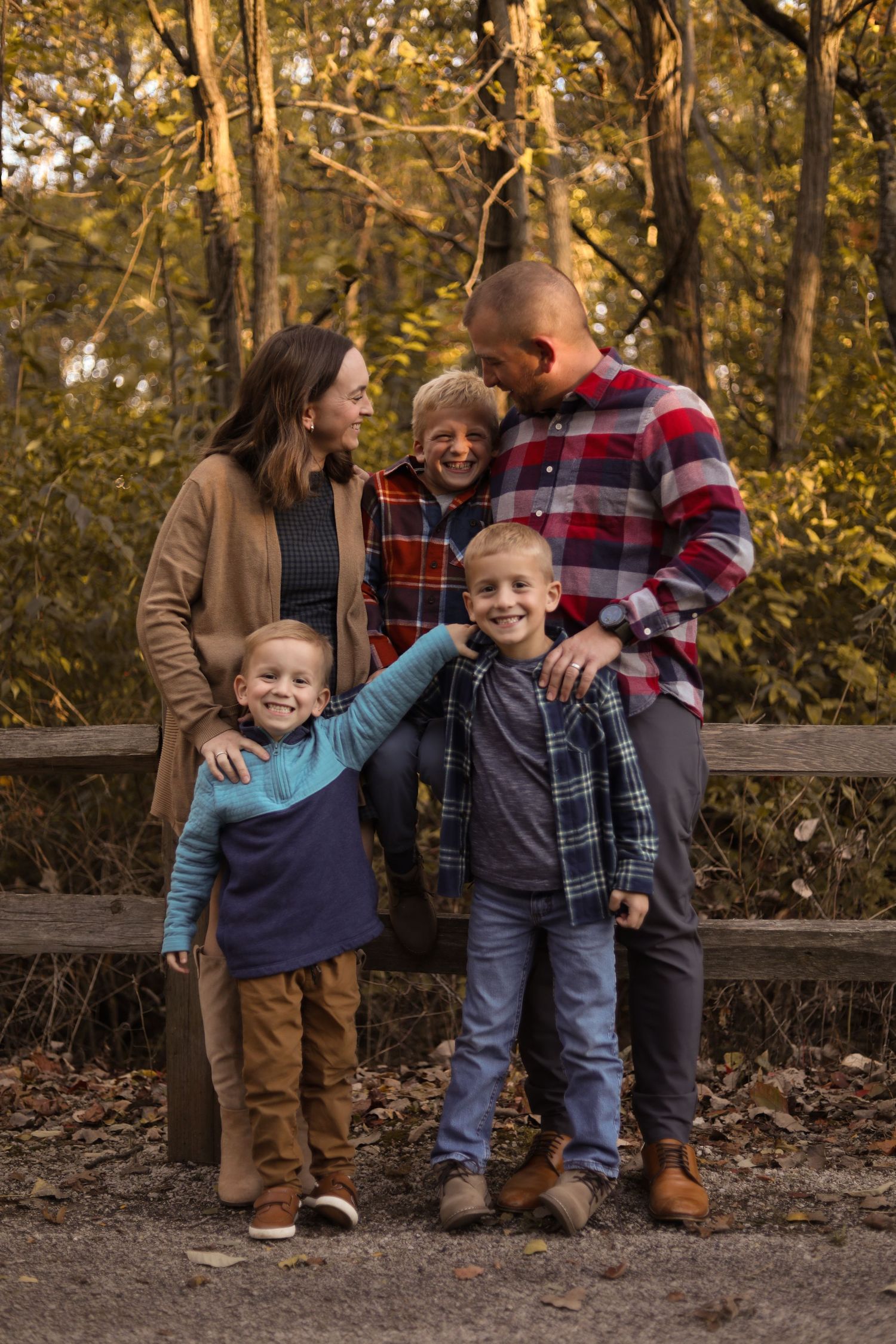 Family portrait sequence in an autumn forest setting with casual attire.
