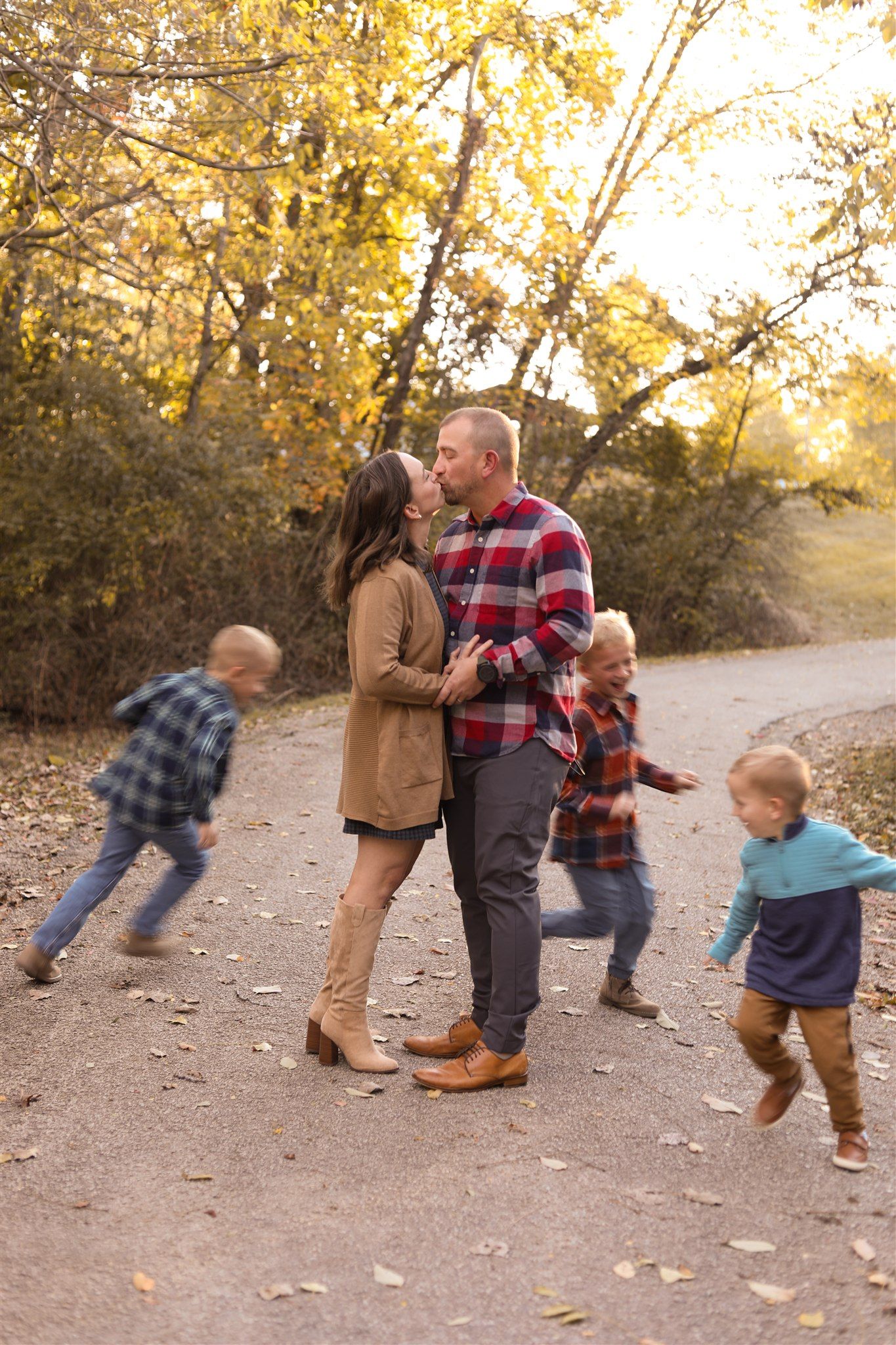 Playful family interaction captured in sequence of candid moments on autumn trail.