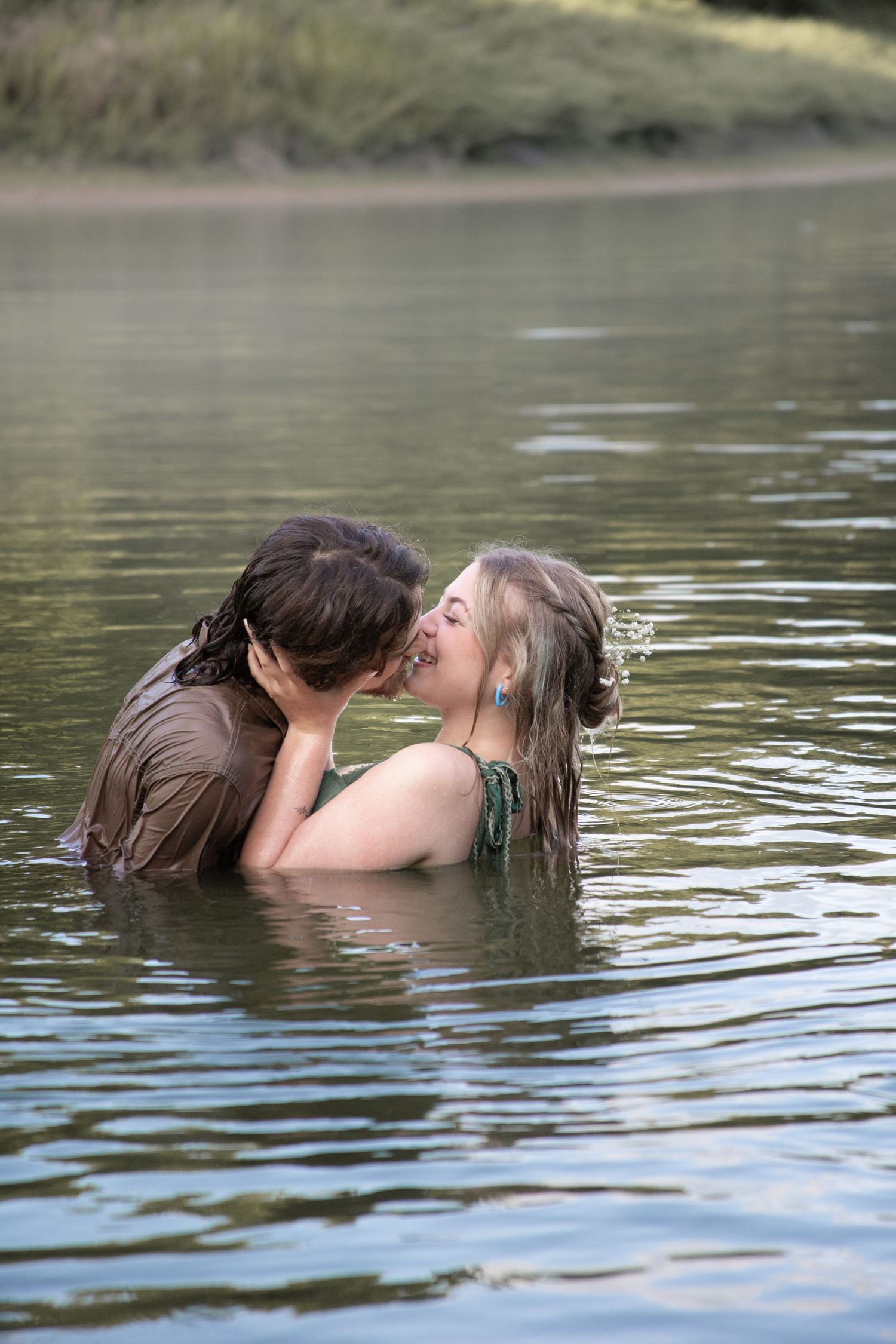 Romantic sequence of a couple sharing intimate moments in a lake setting.