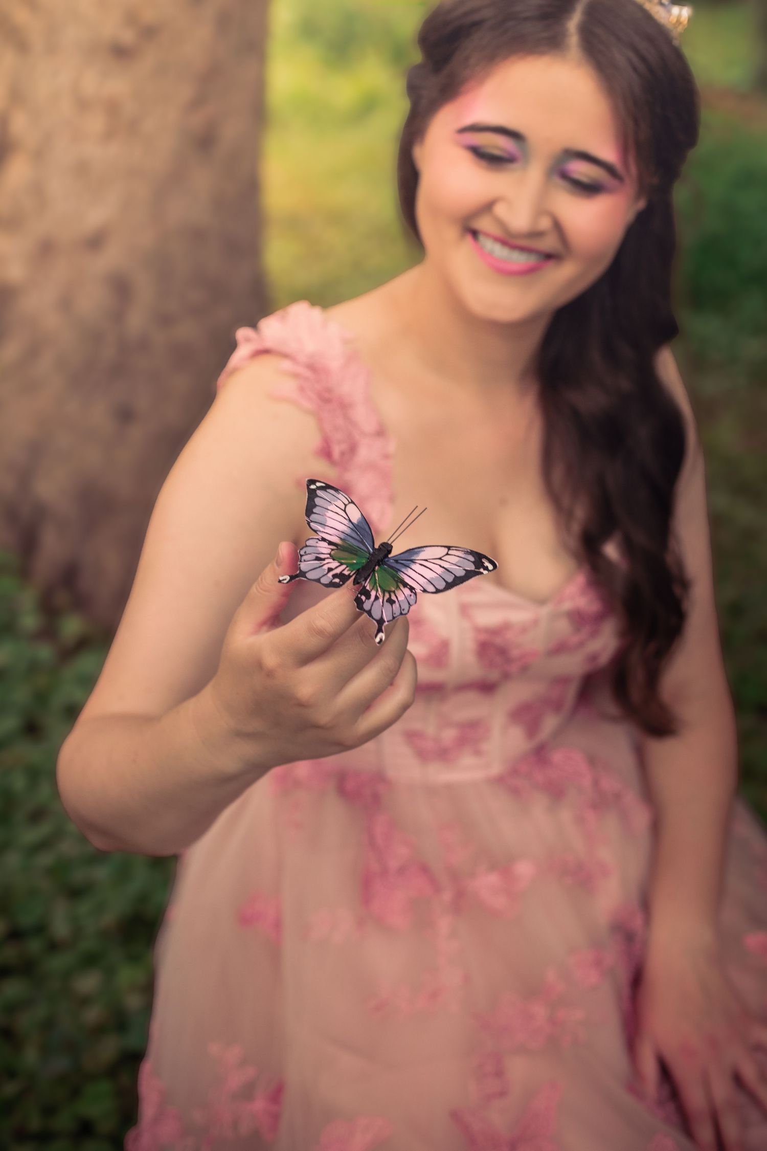 A sequence of photos shows a delicate butterfly landing on a pink floral dress in a garden setting.