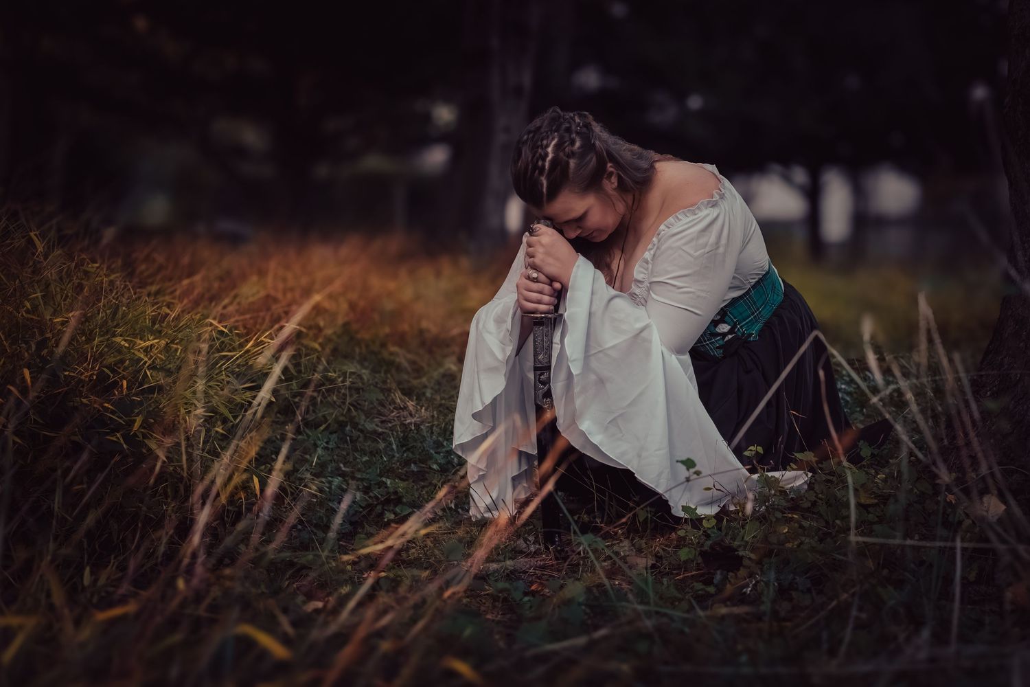 A series of moody outdoor photographs showing someone in white clothing against dark natural backgrounds.