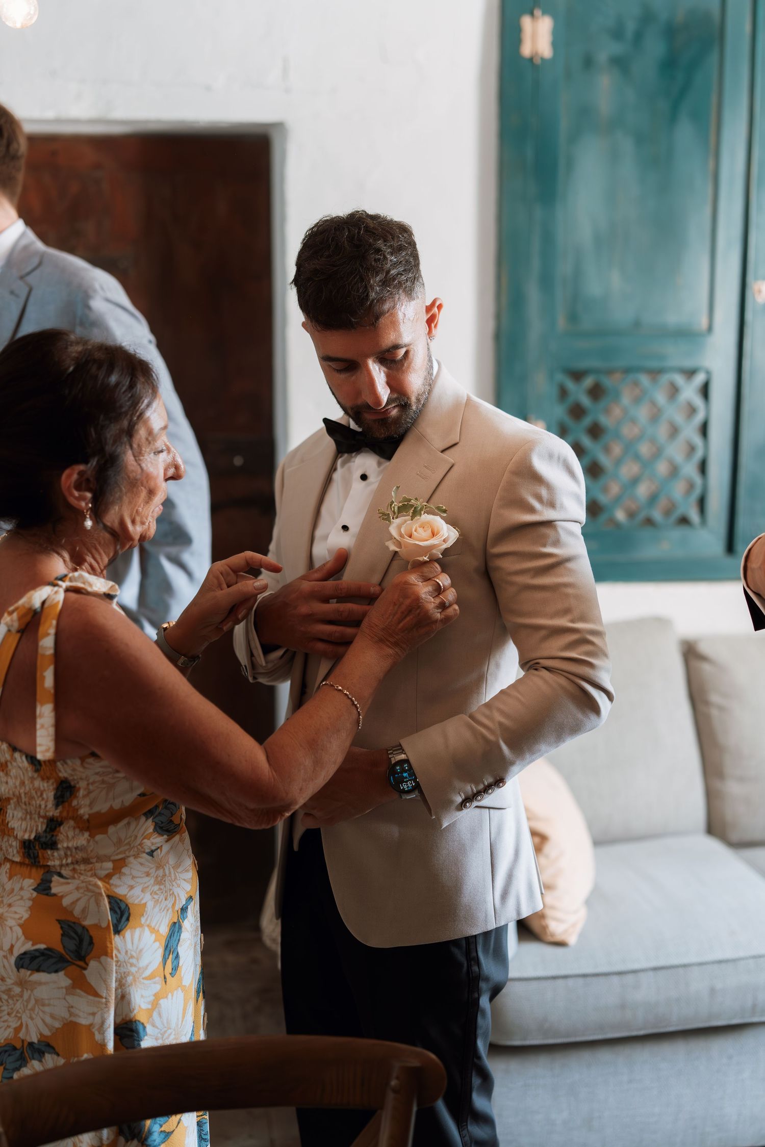 A couple shares an intimate dance moment in formal attire at their wedding.