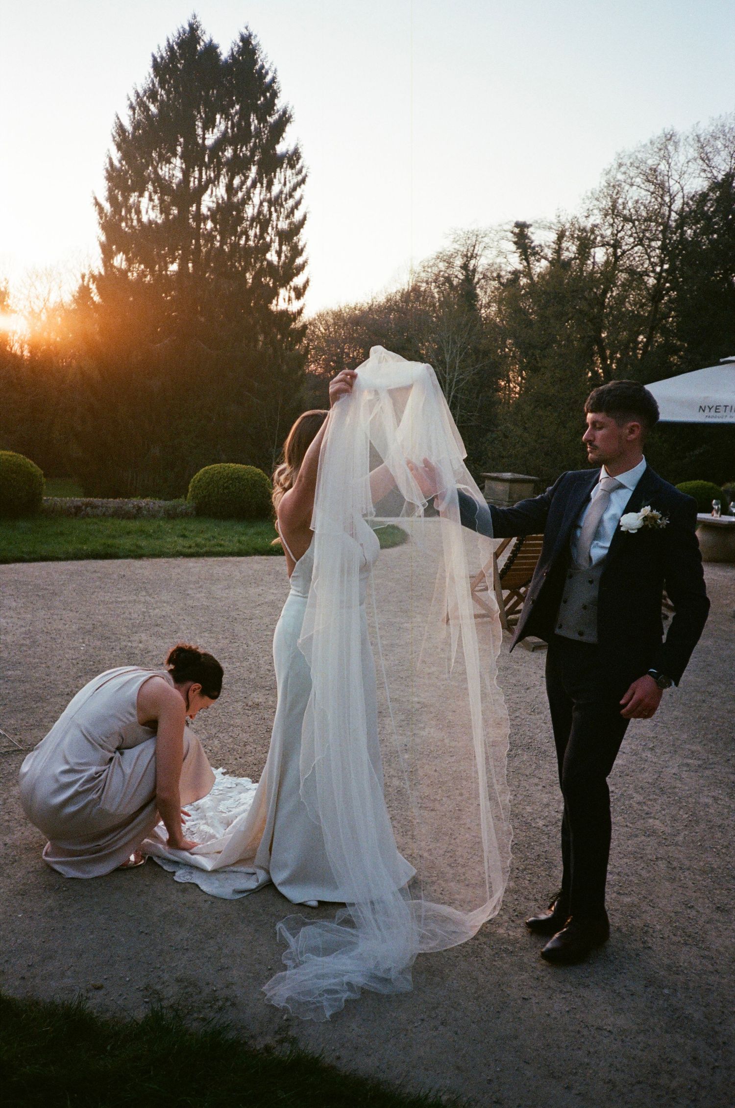 A romantic sunset wedding photoshoot sequence shows a couple in formal attire on a sandy beach with trees in the background.