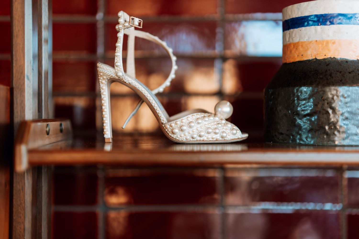 Close-up detail shots of decorative items on wooden shelves with soft focus.