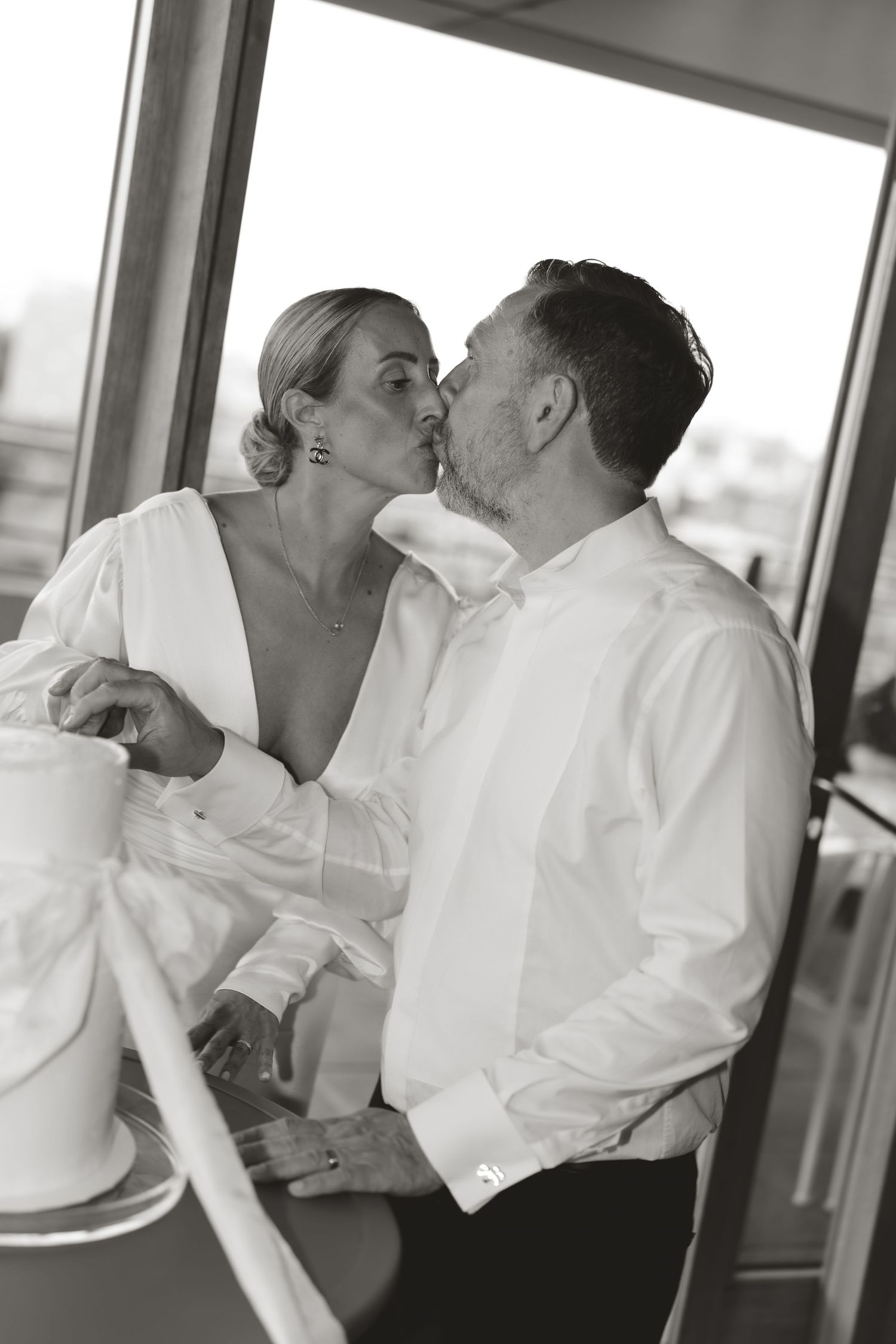Black and white photos capture tender moments between newlyweds during their first dance.