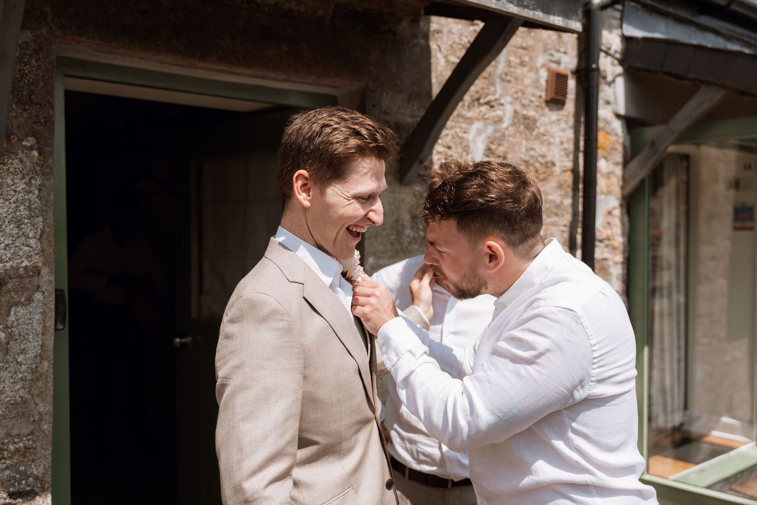 Two people in formal attire interacting playfully in a sequence of photos.