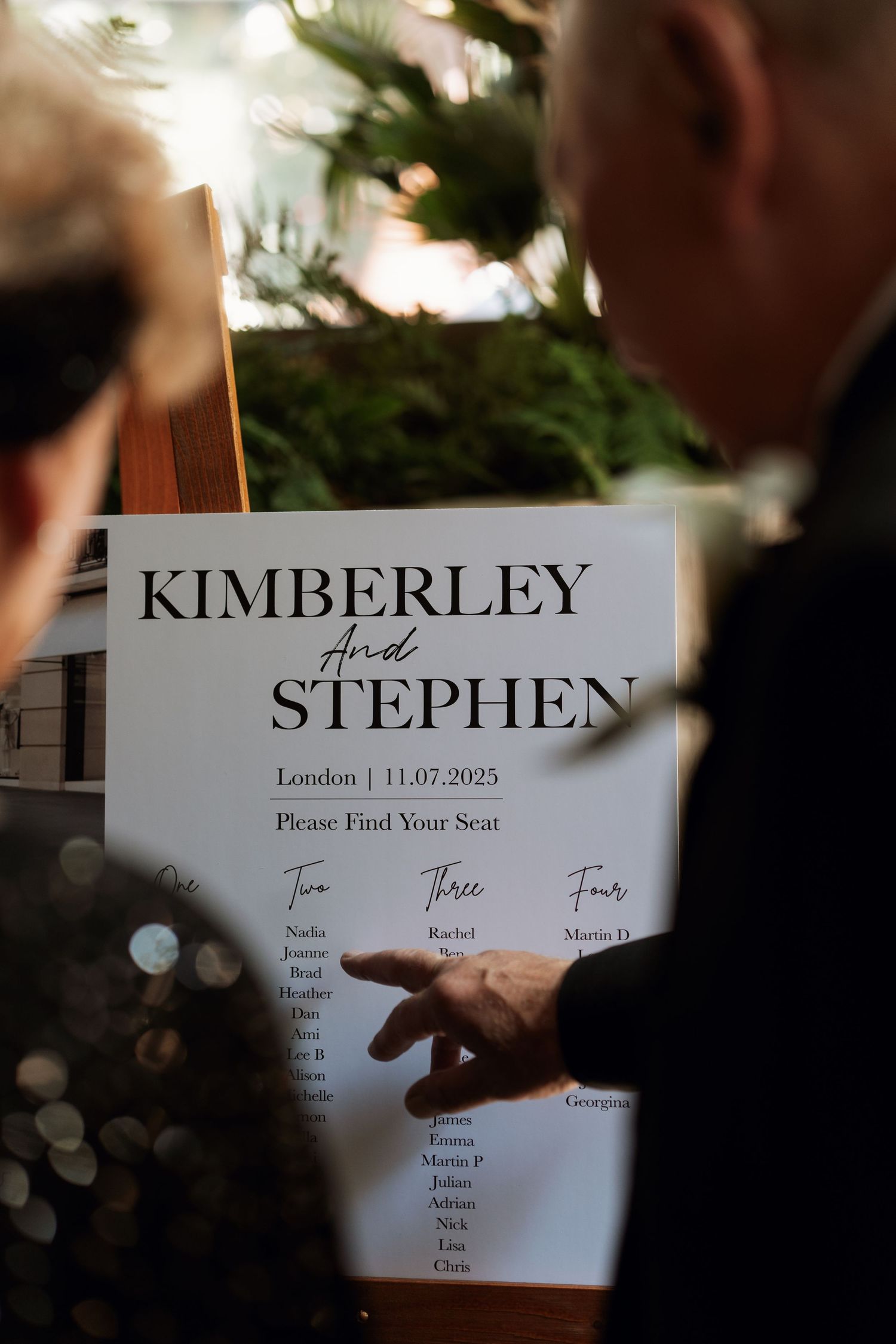 Wedding seating chart signs displayed with names Kimberley and Stephen.