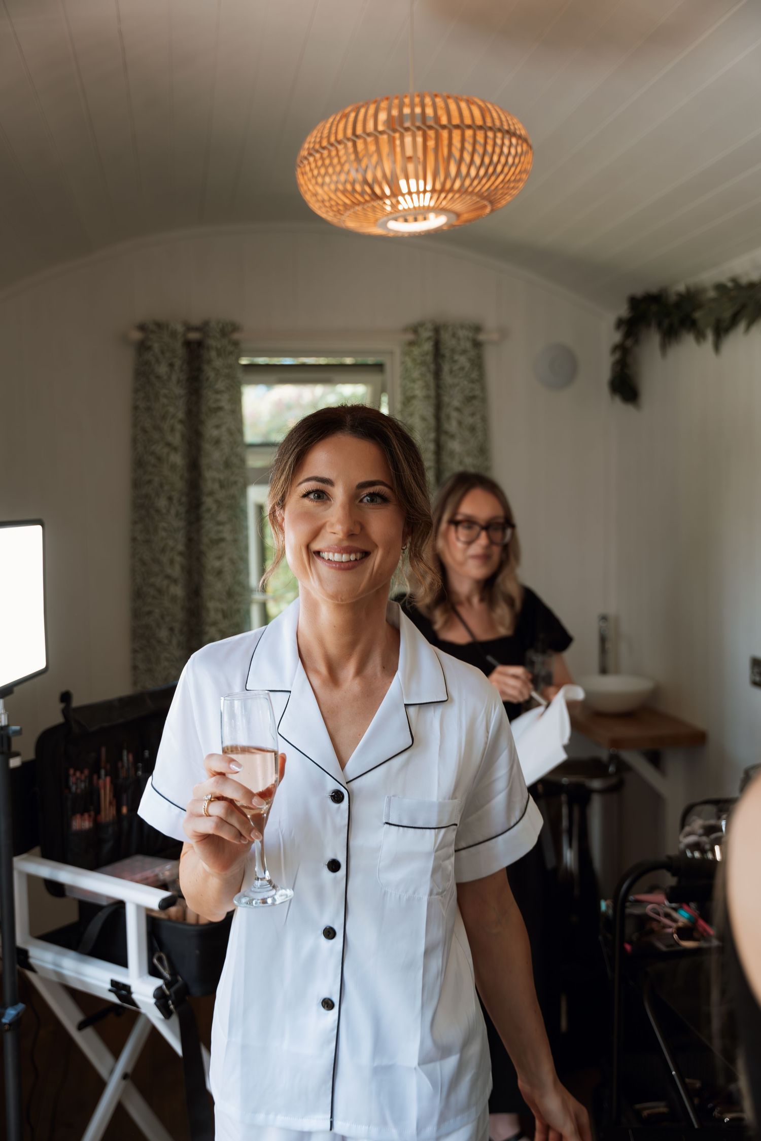 A sequence of photos showing someone in a white nursing uniform smiling in a bright interior space.