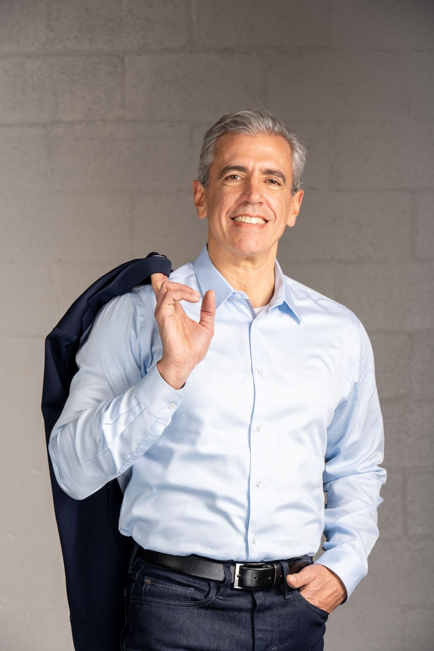 Confident executive portrait with soft directional light and neutral backdrop. Professional, approachable, and refined.