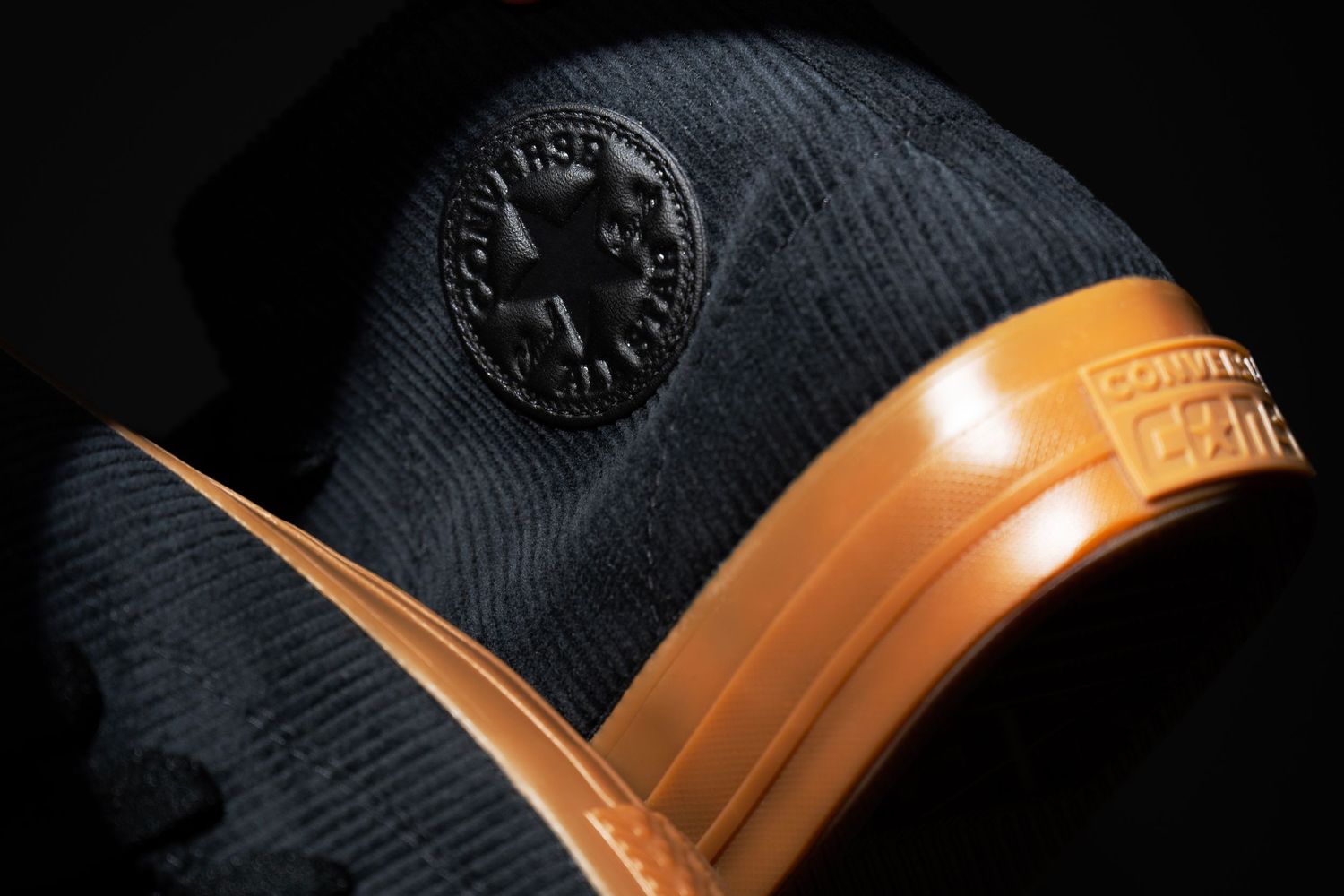 Close-up of Converse sneaker with textured rubber sole, photographed for footwear and lifestyle branding.